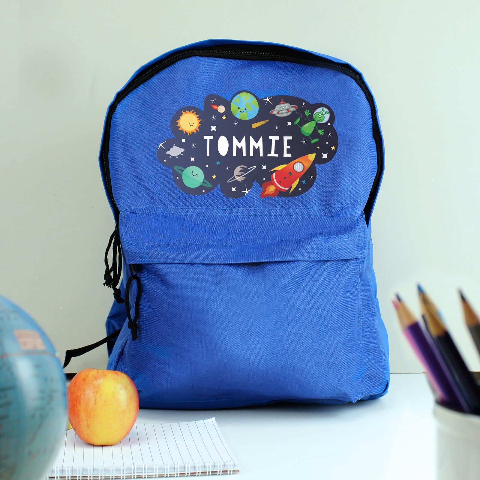 Blue space backpack with a name and a front zip pocket