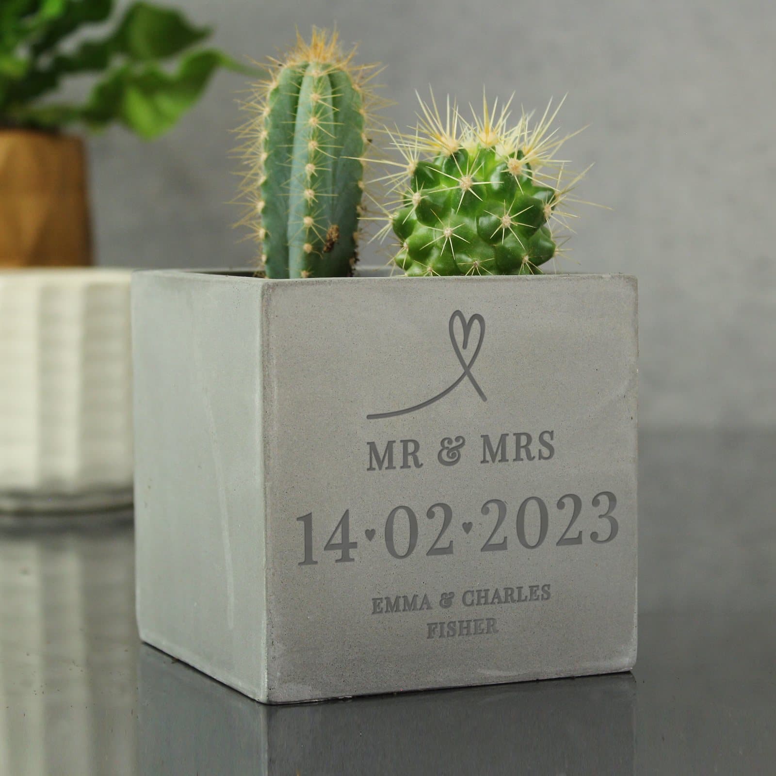 Concrete plant pot personalised with a message and a special date