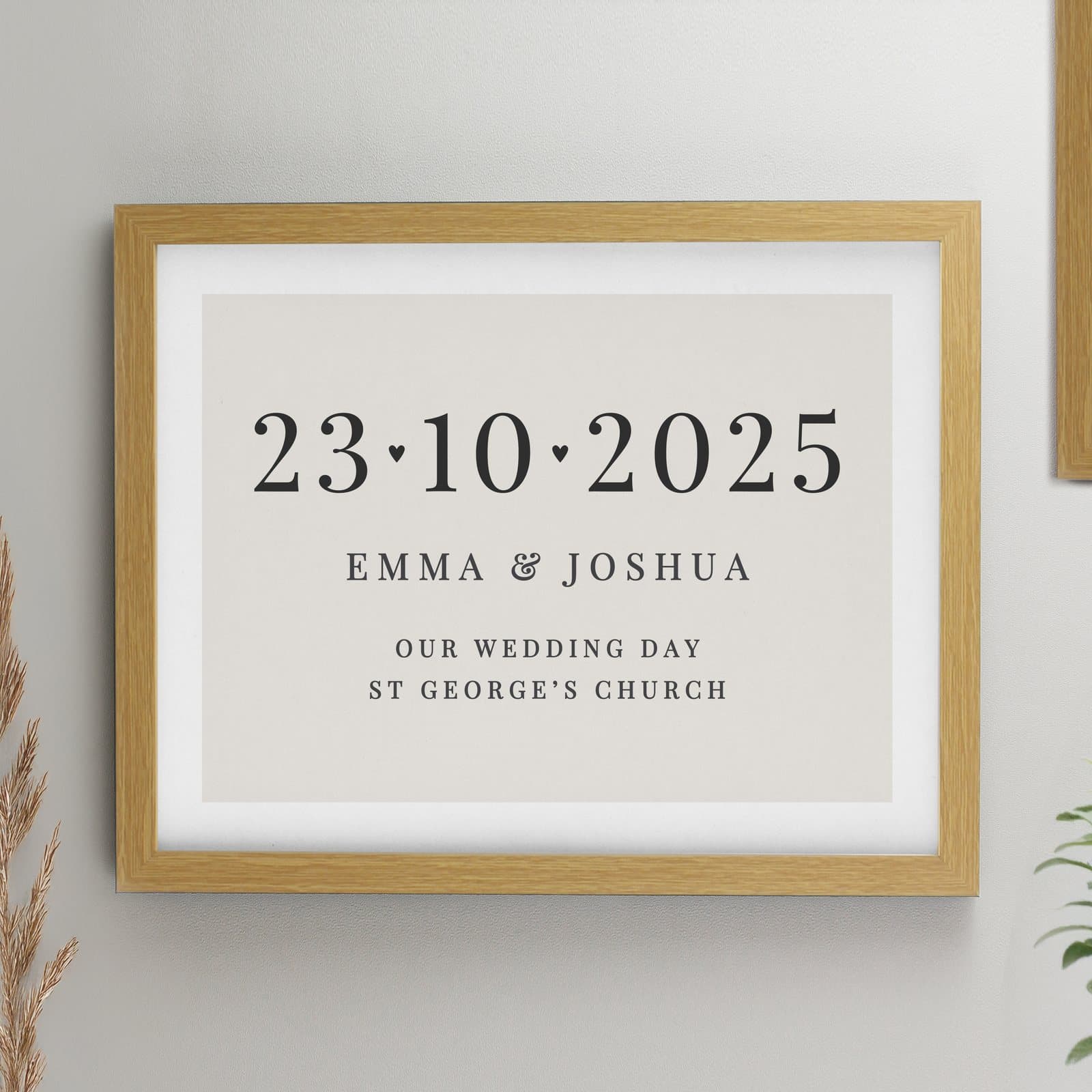 Oak framed print with a personalised date, hearts and three lines of text