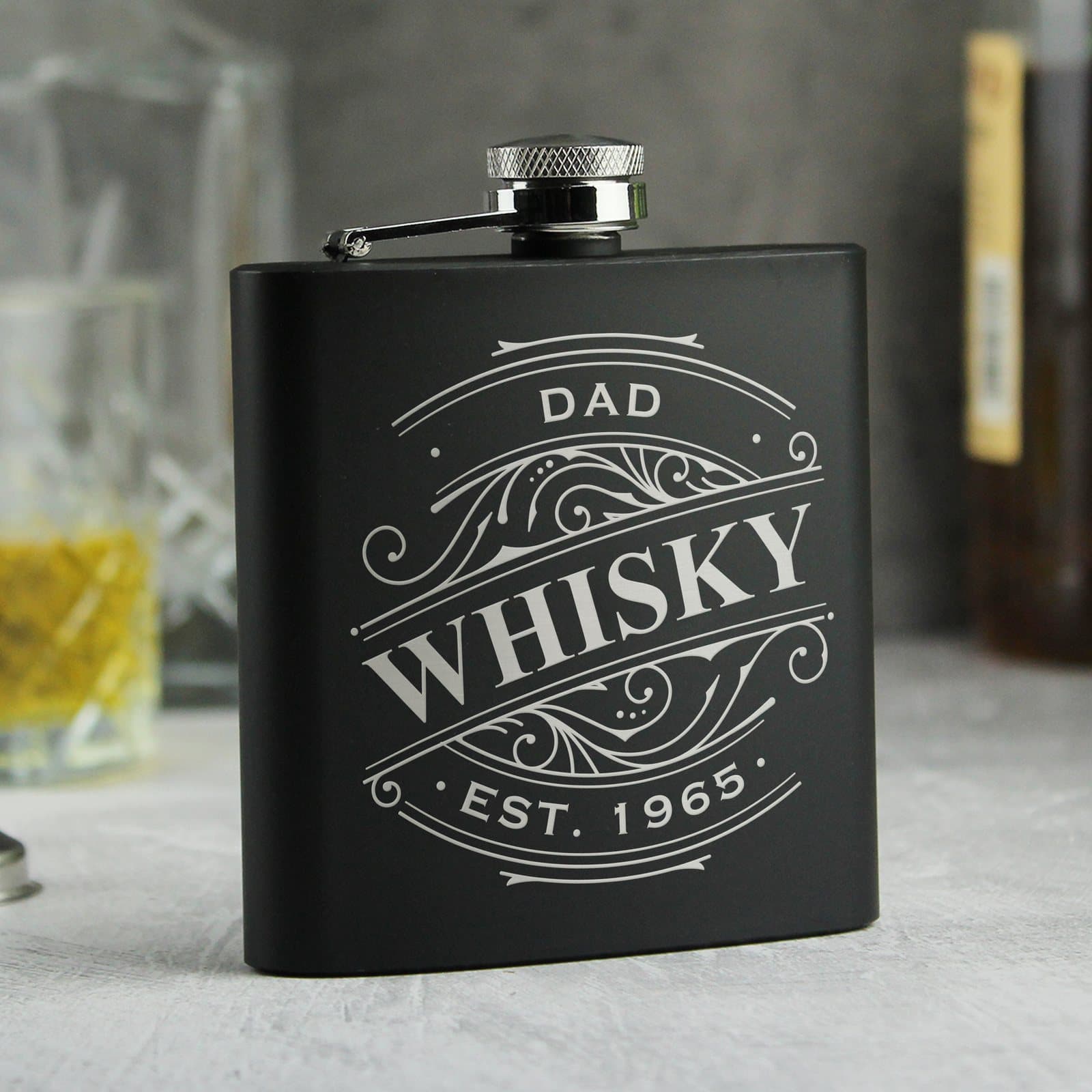 Black stainless steel hip flask with three lines of text