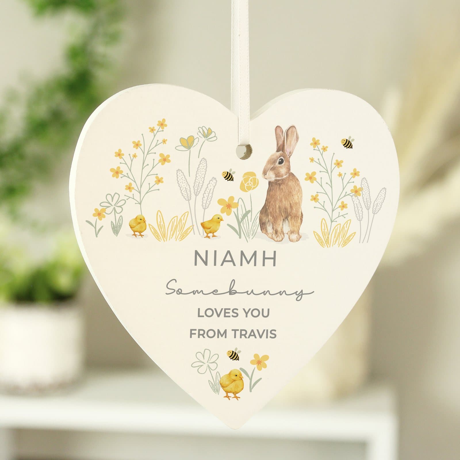 Wooden heart ornament with a spring bunny design and ribbon