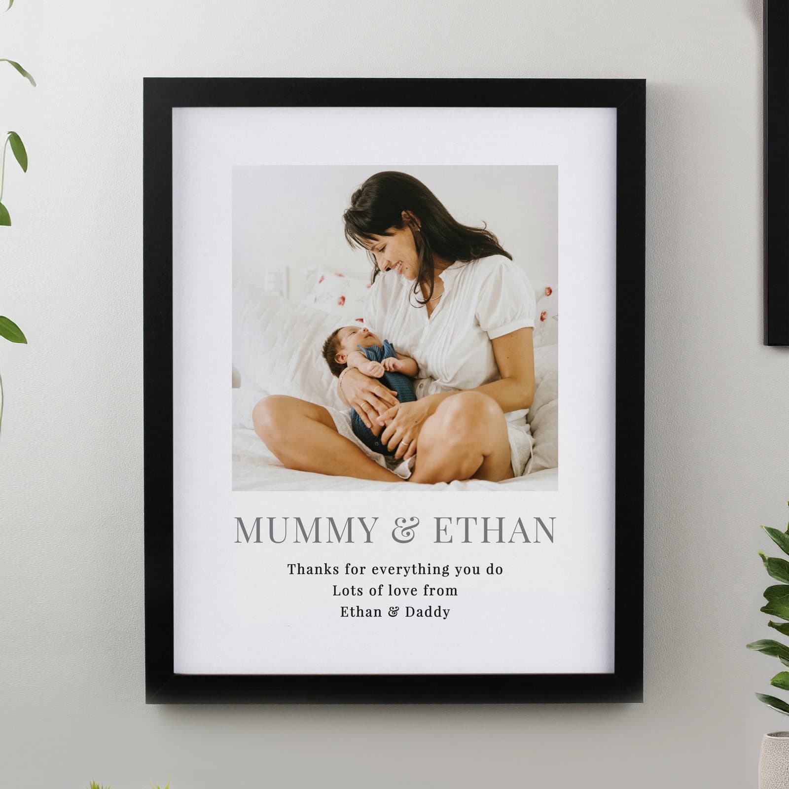 Black or white portrait poster frame with a photo and four lines of text