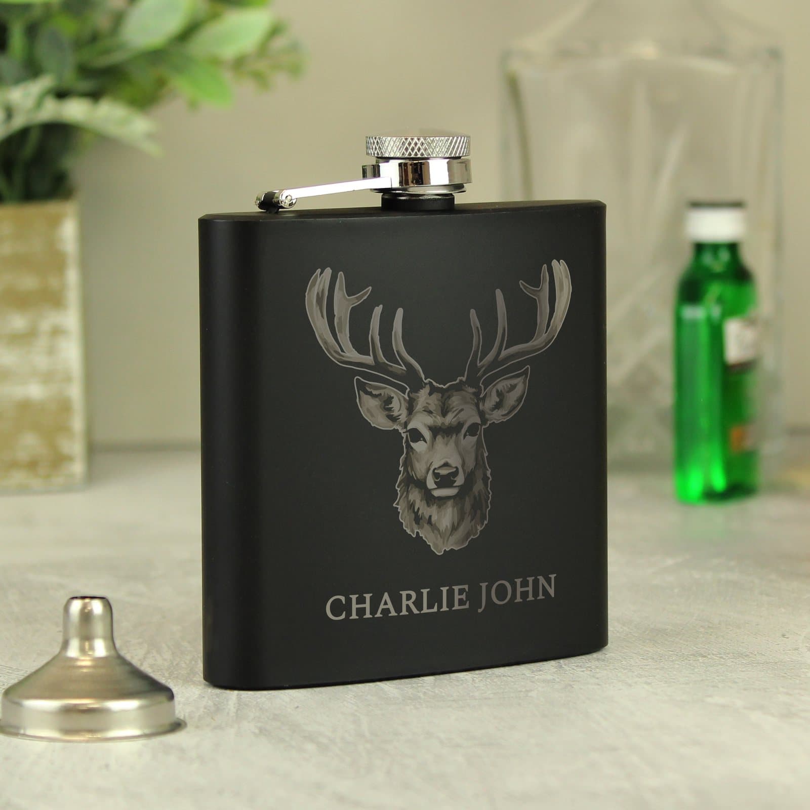 Matte black stainless steel hip flask with an engraved name
