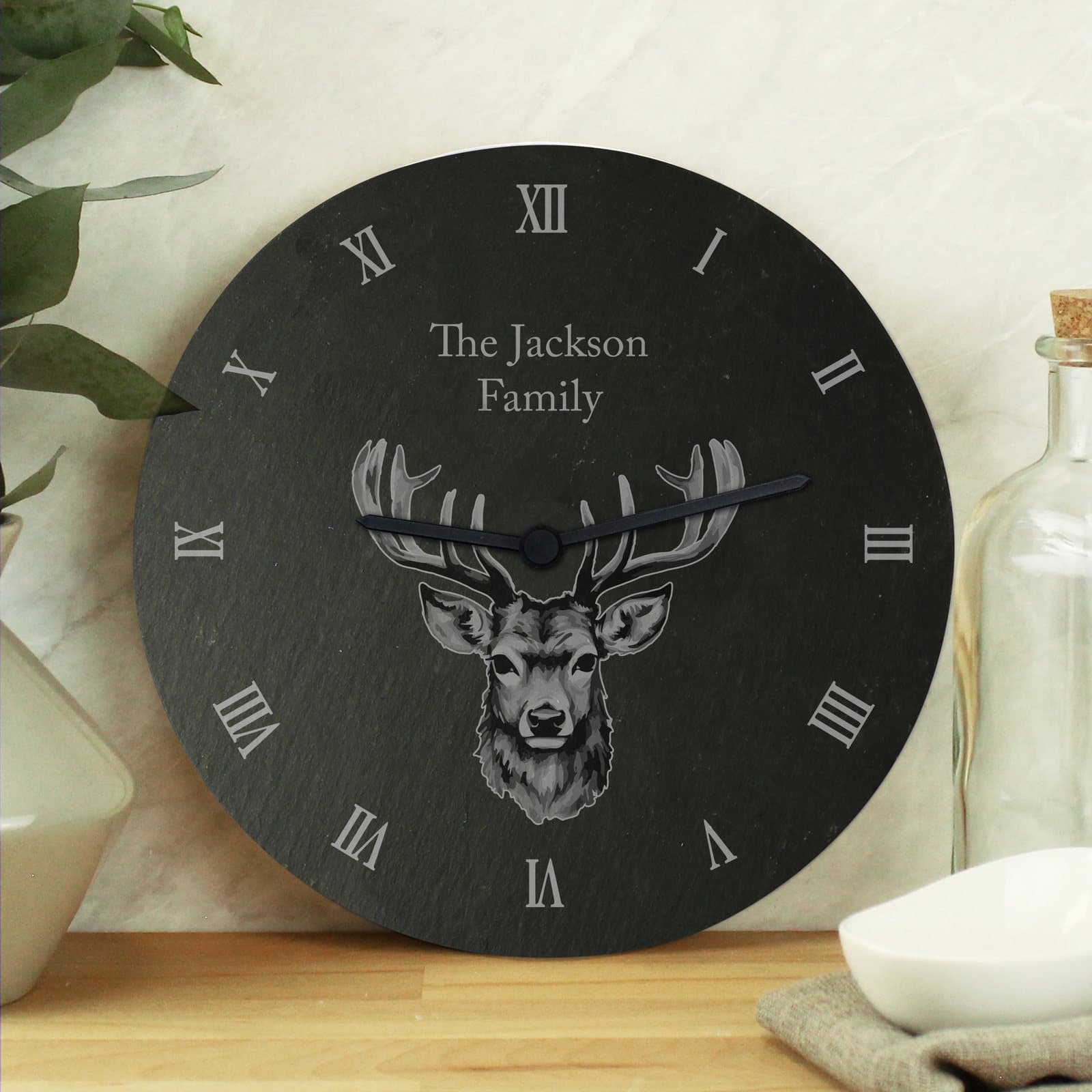 Slate clock with a stag design and two lines of personalised text