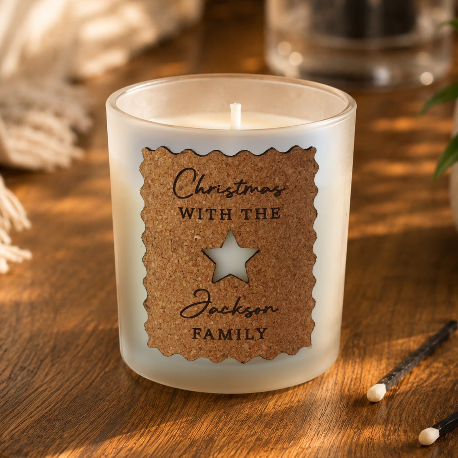 Candle jar with a personalised star cut out cork label