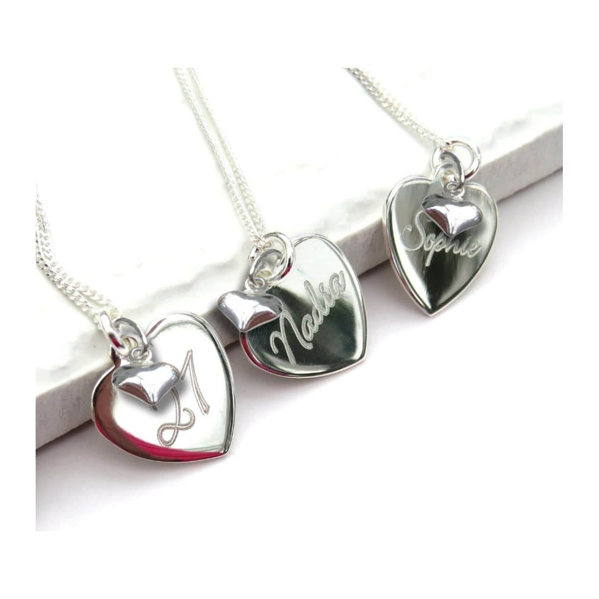 Sterling silver heart necklace with a mini heart charm on a fine chain