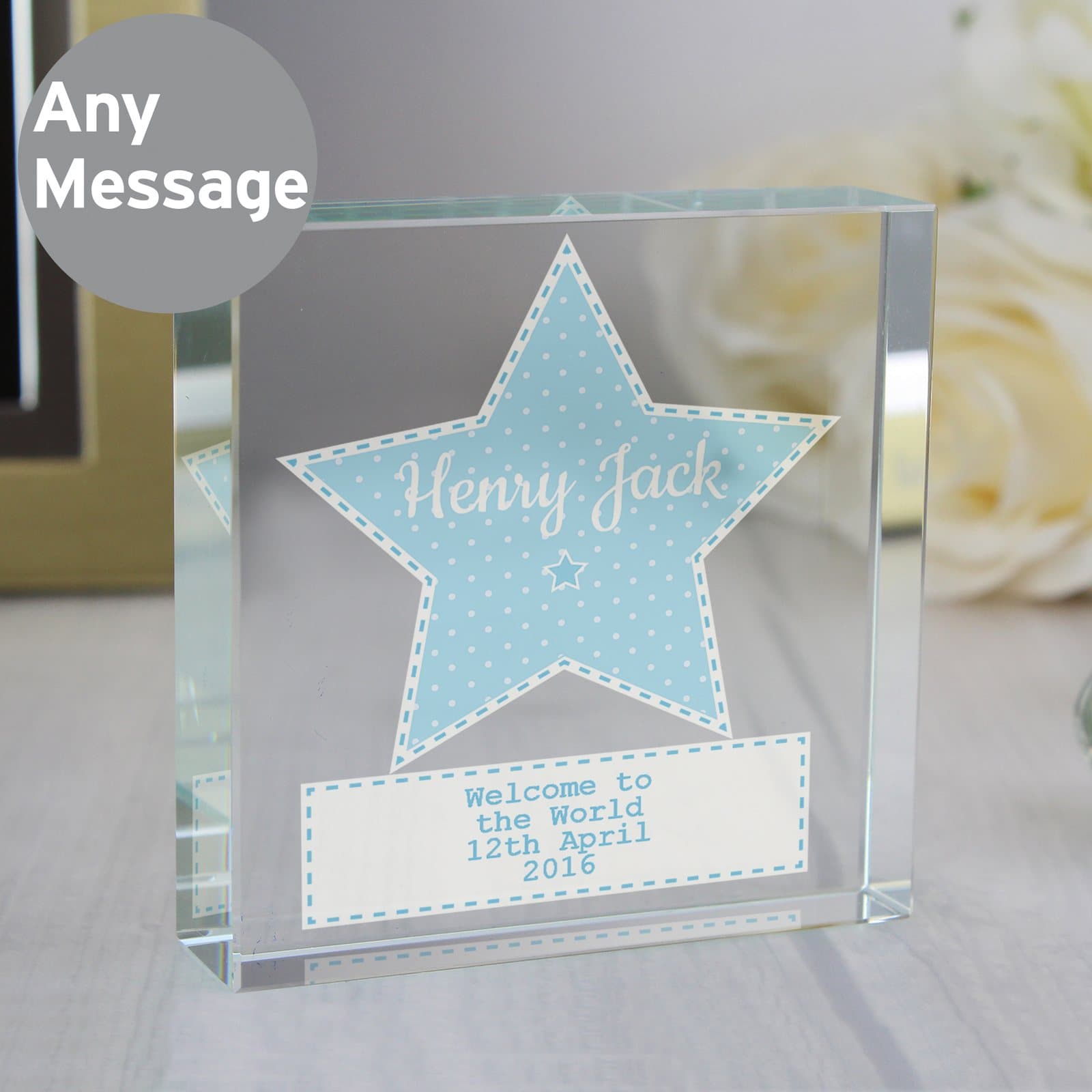 Crystal token with a star holding a name and a message below, shown with a black gift box