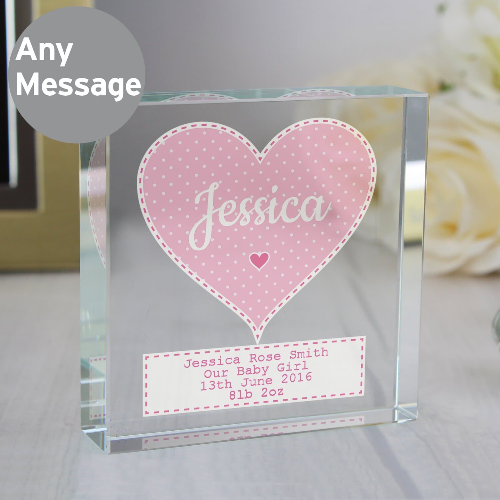 Crystal token with a heart holding a name and a message below, shown with a black gift box