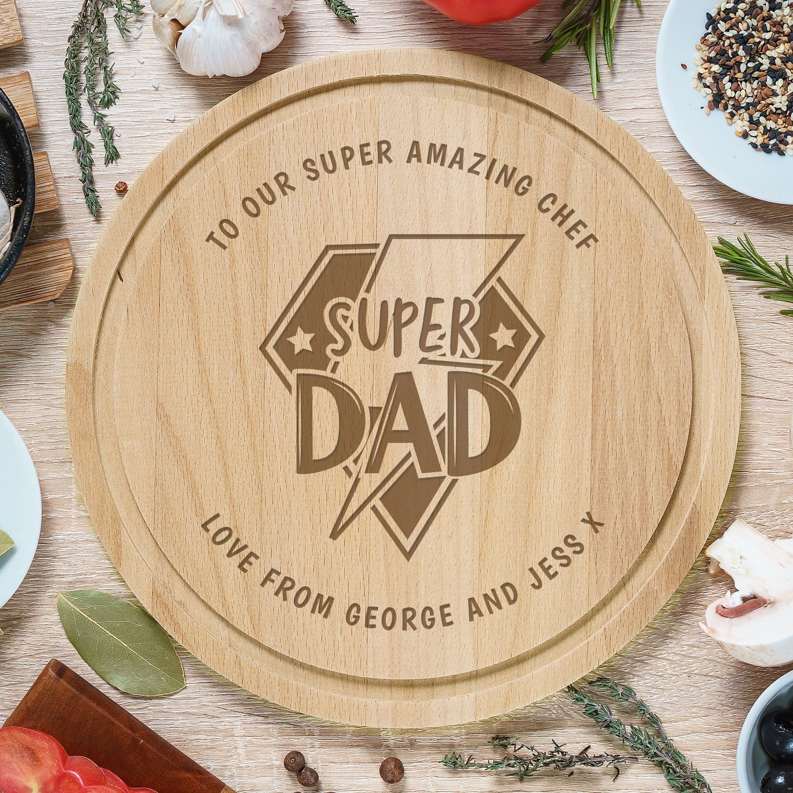 Round wooden chopping board with a Super Dad design at the centre
