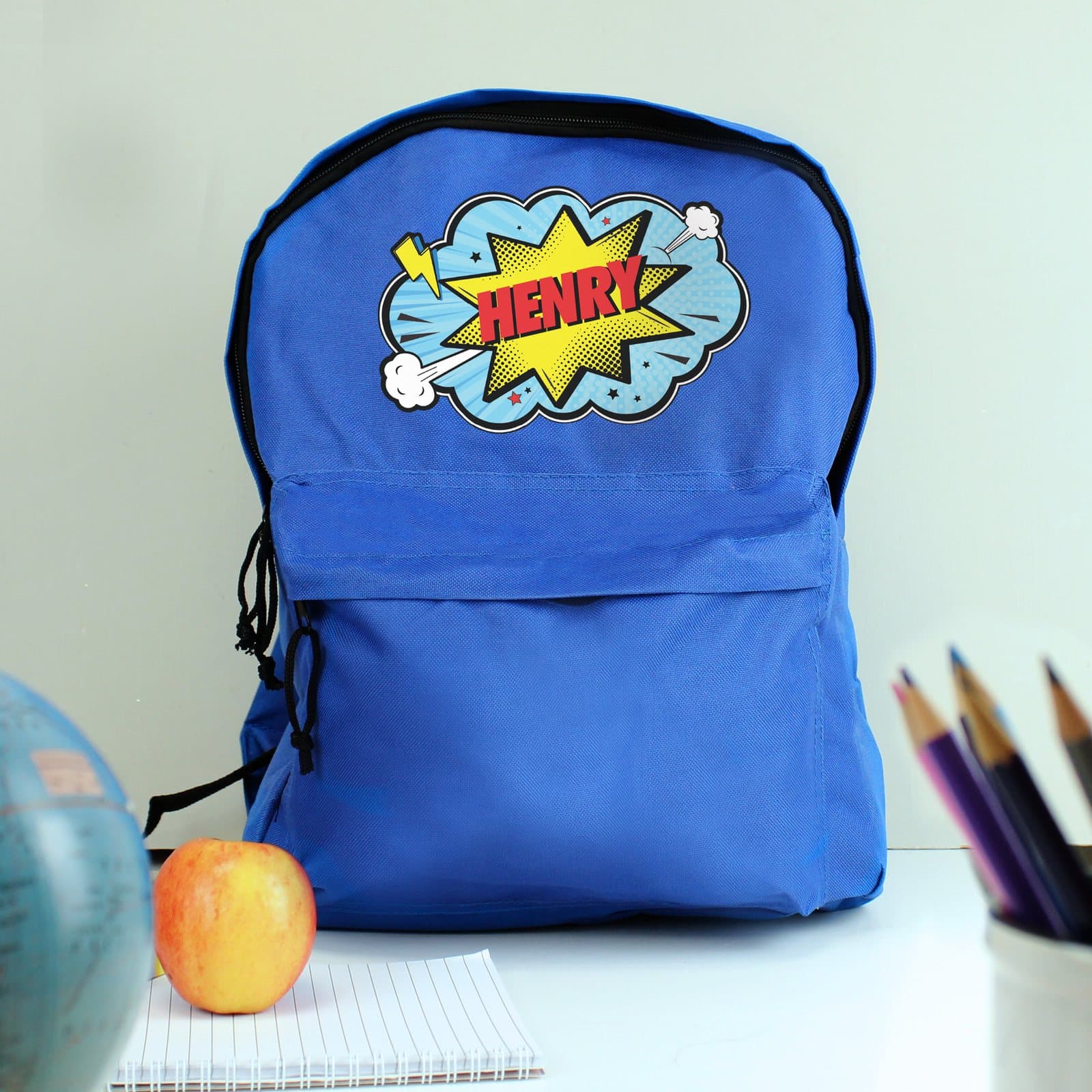 Blue superhero backpack with front zip pocket and padded straps