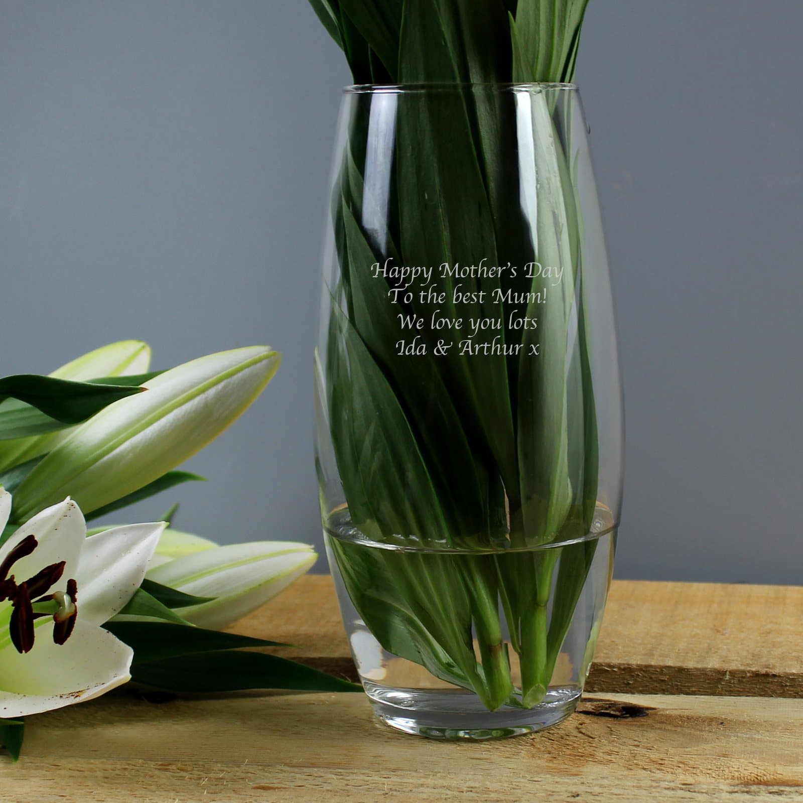 Tapered glass bullet vase with a personalised four-line message on the front