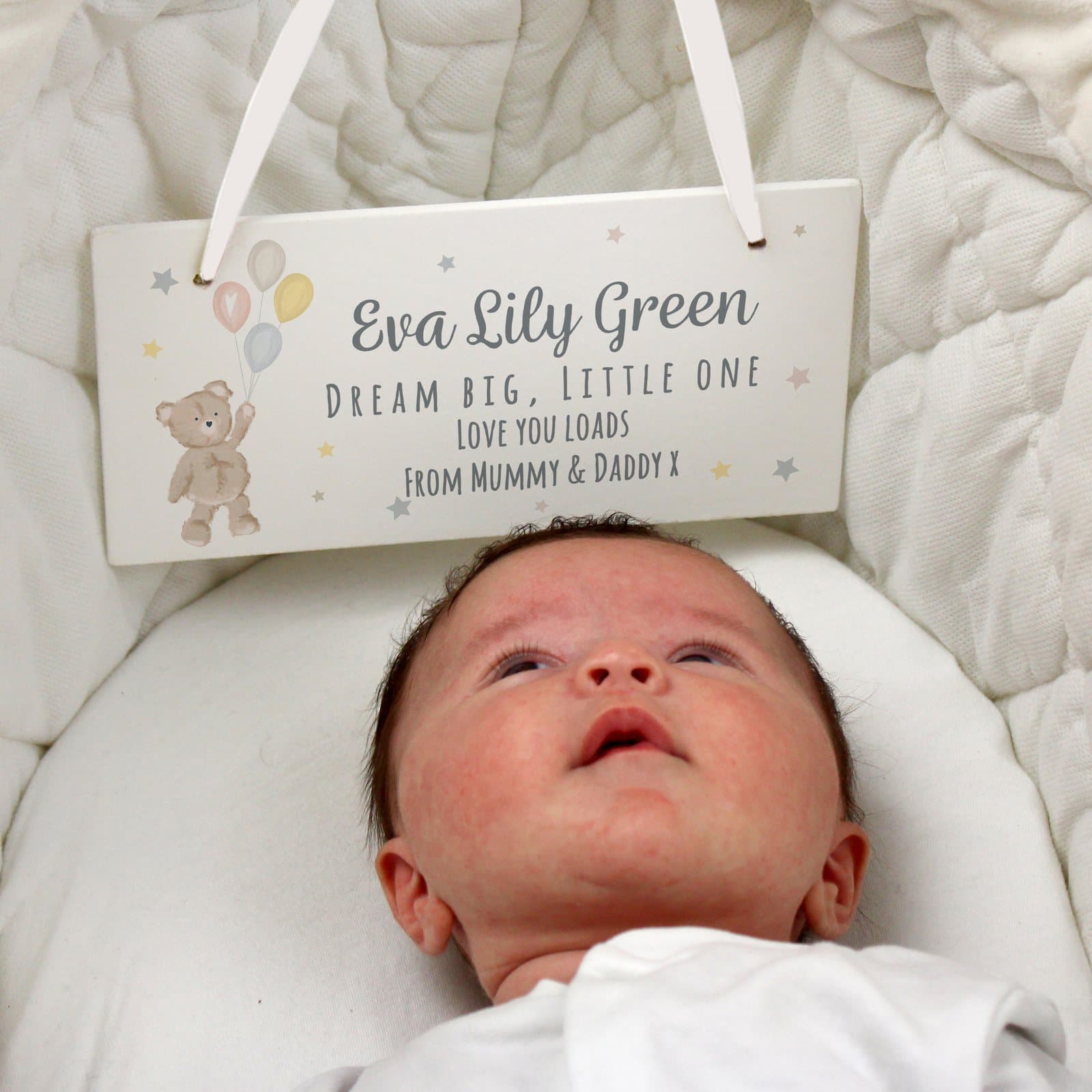 White wooden hanging sign with a teddy and balloons and ribbon