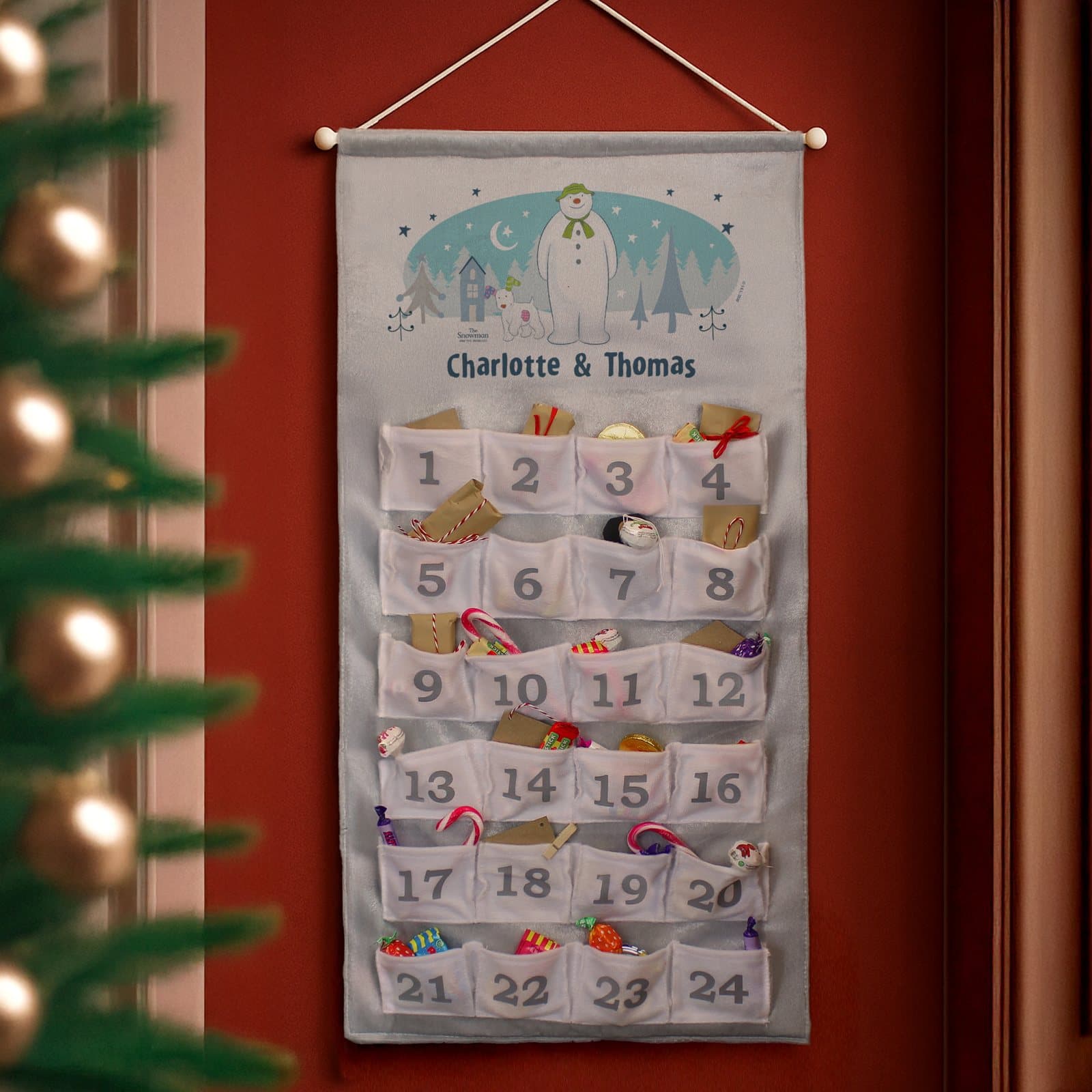 Silver grey The Snowman and the Snowdog advent calendar with numbered pockets