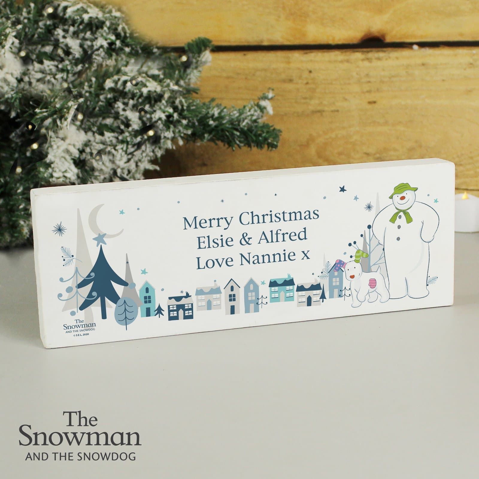 Solid wood mantel sign with The Snowman and the Snowdog design and three lines of text