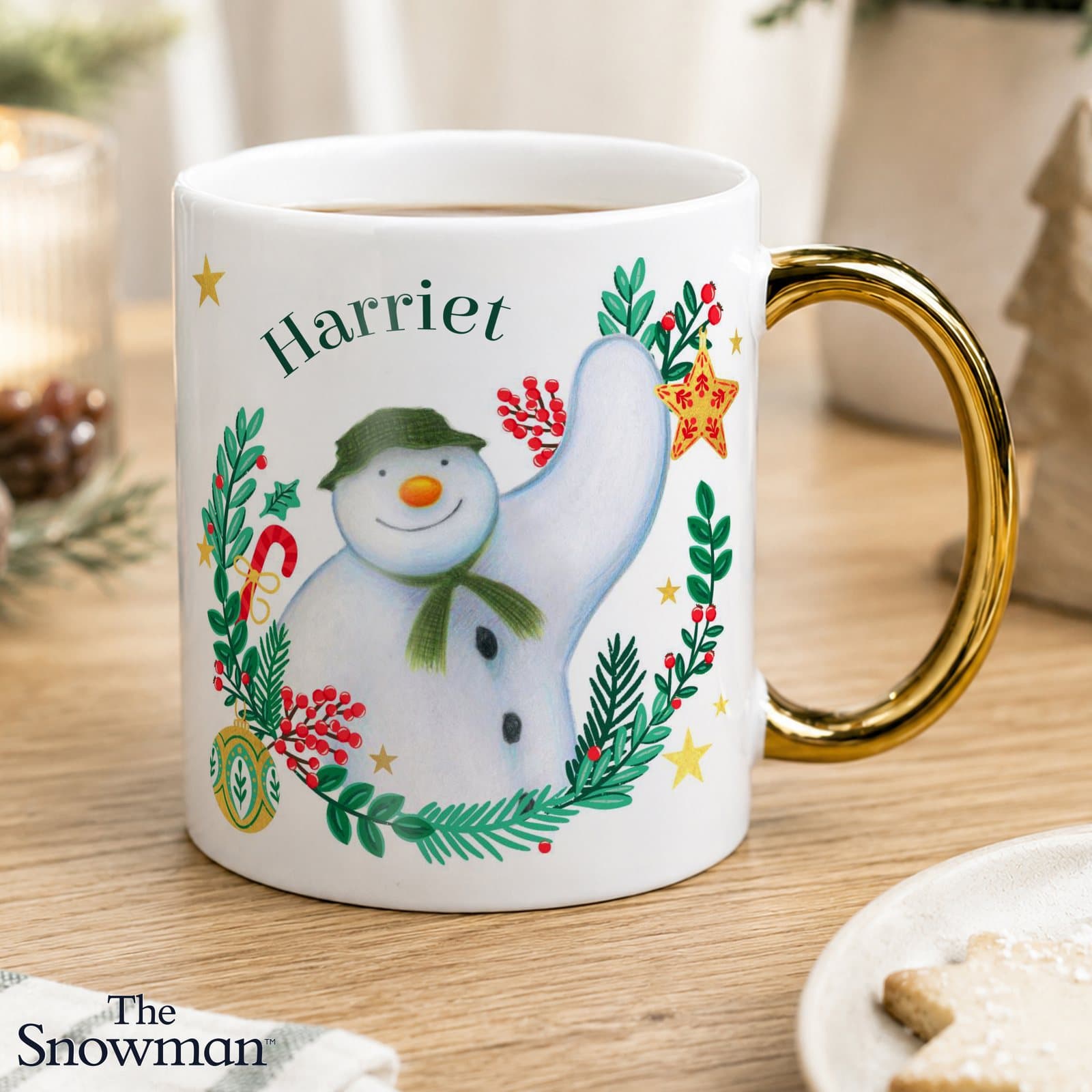 Ceramic The Snowman Christmas Wishes mug with a gold handle