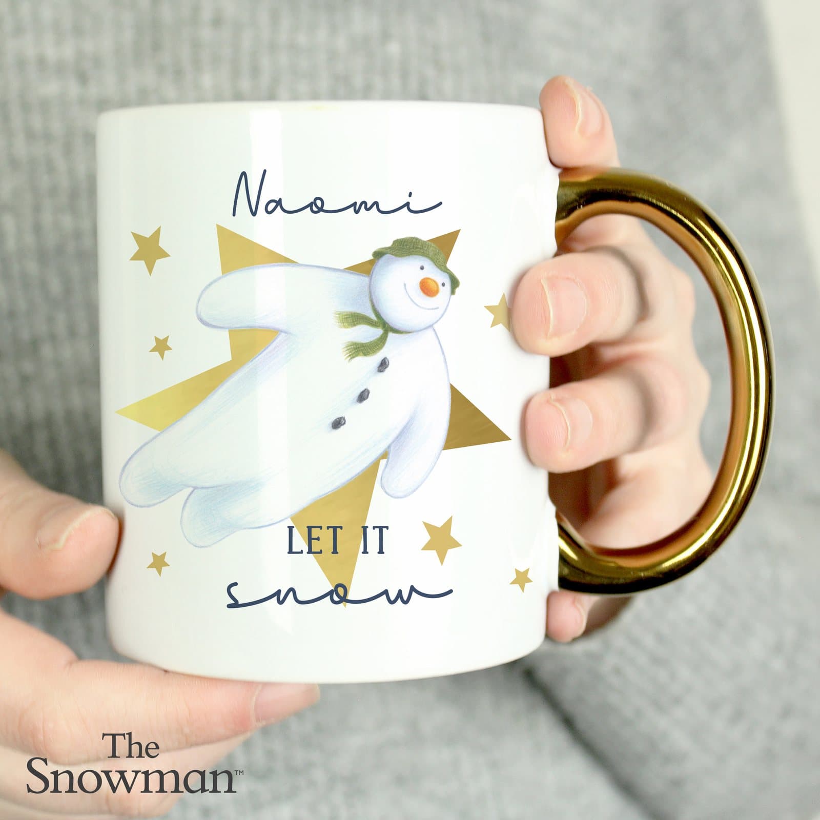Ceramic The Snowman Let It Snow mug with a gold handle