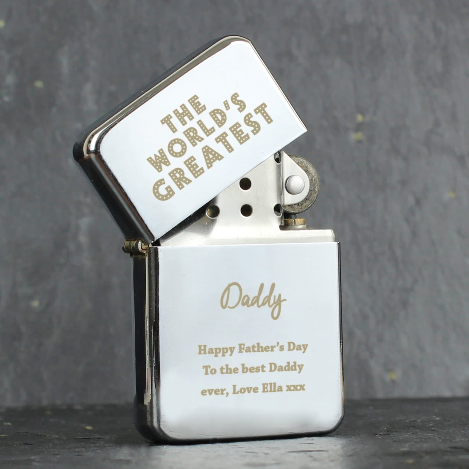 Silver oil lighter with The World's Greatest wording