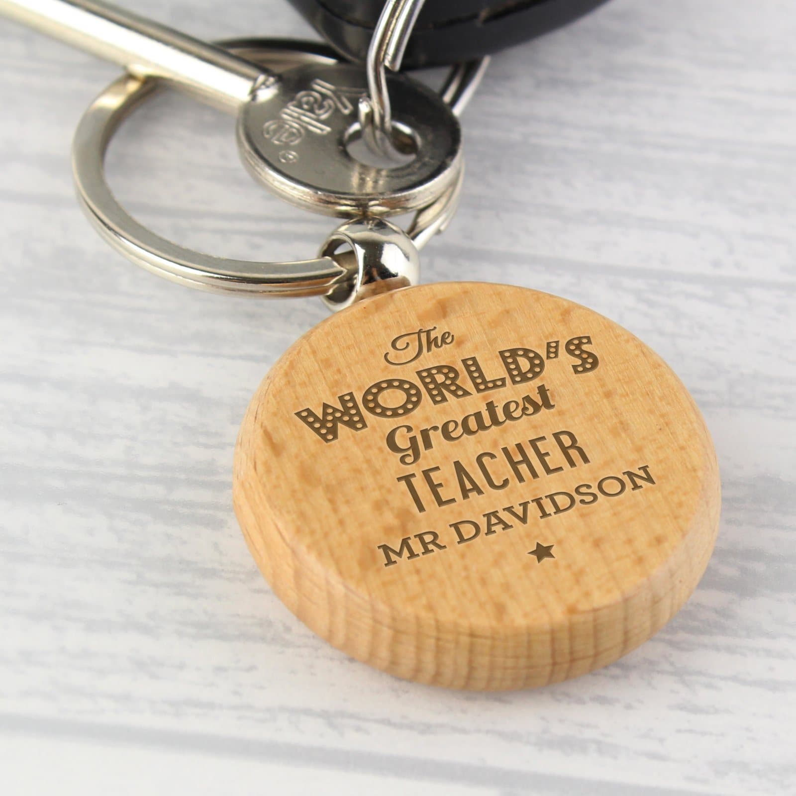 Wooden keyring personalised with The World's Greatest, an activity and a name