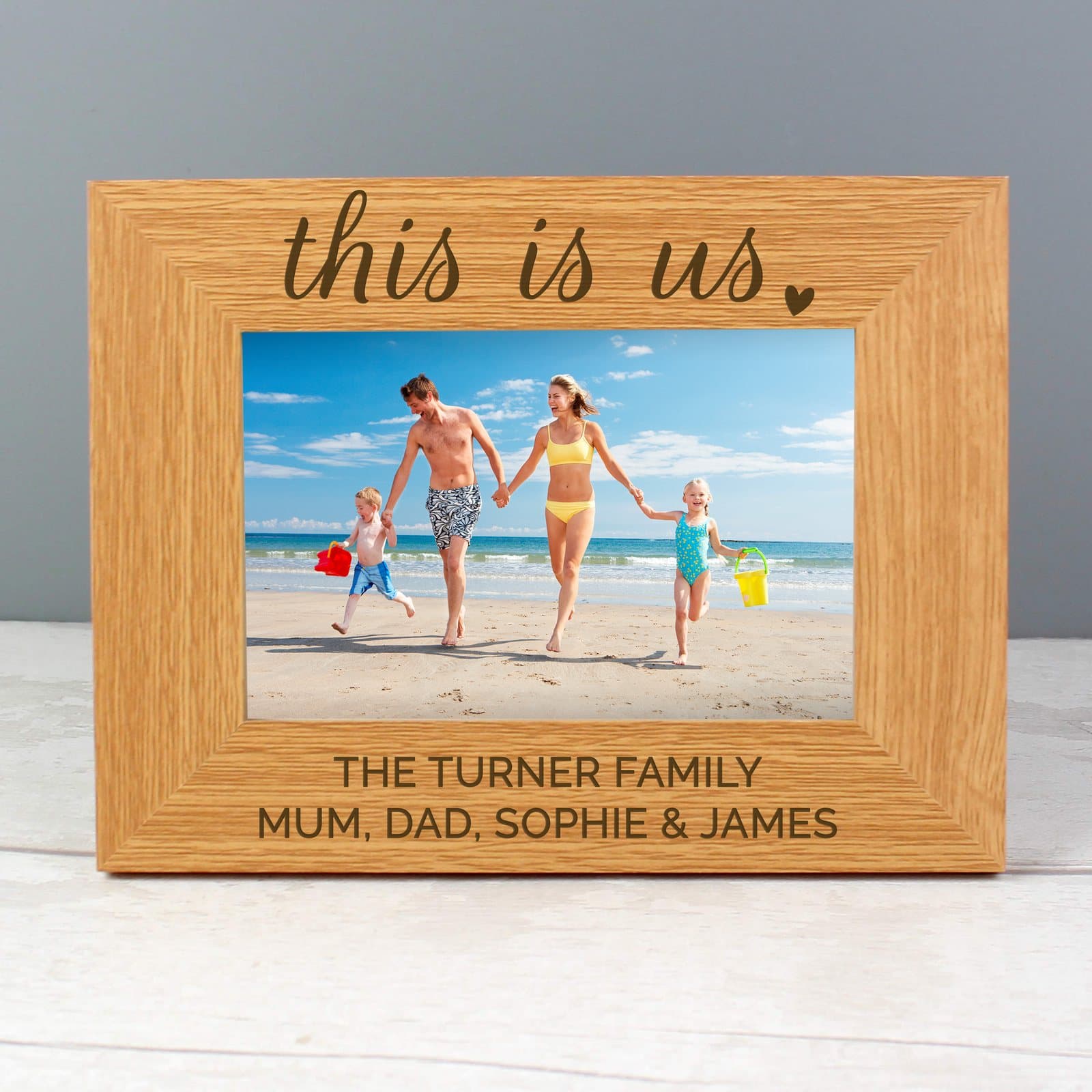 Landscape oak veneer photo frame with two personalised message lines below the photo