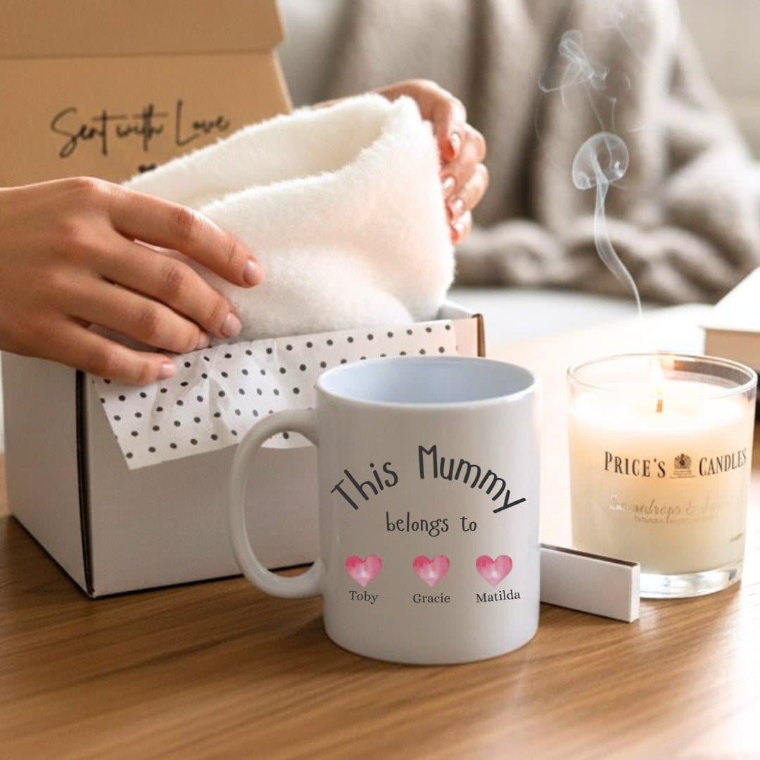 Personalised mug with pink hearts design, with socks, a candle and matches