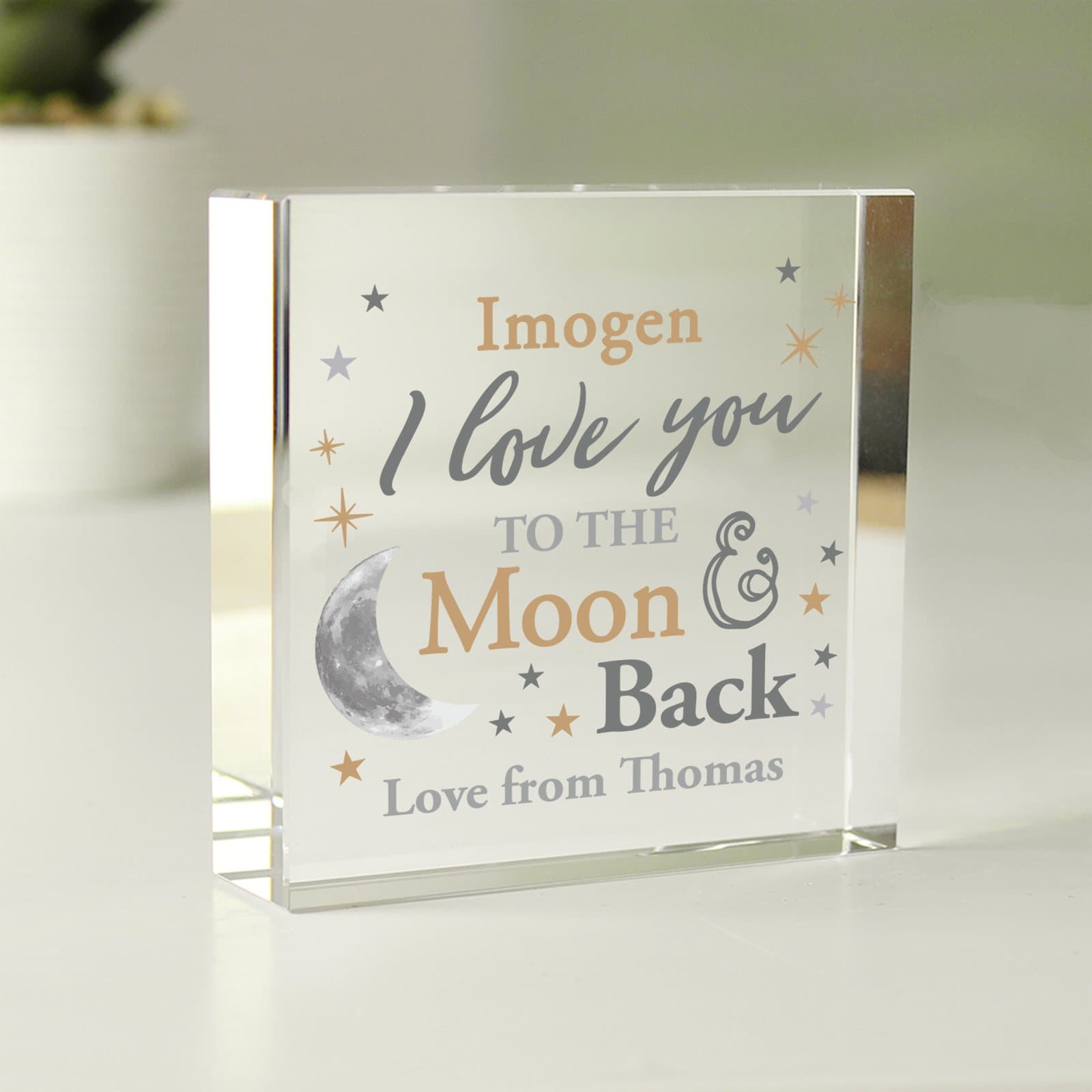 Glass crystal token with a to the moon and back design