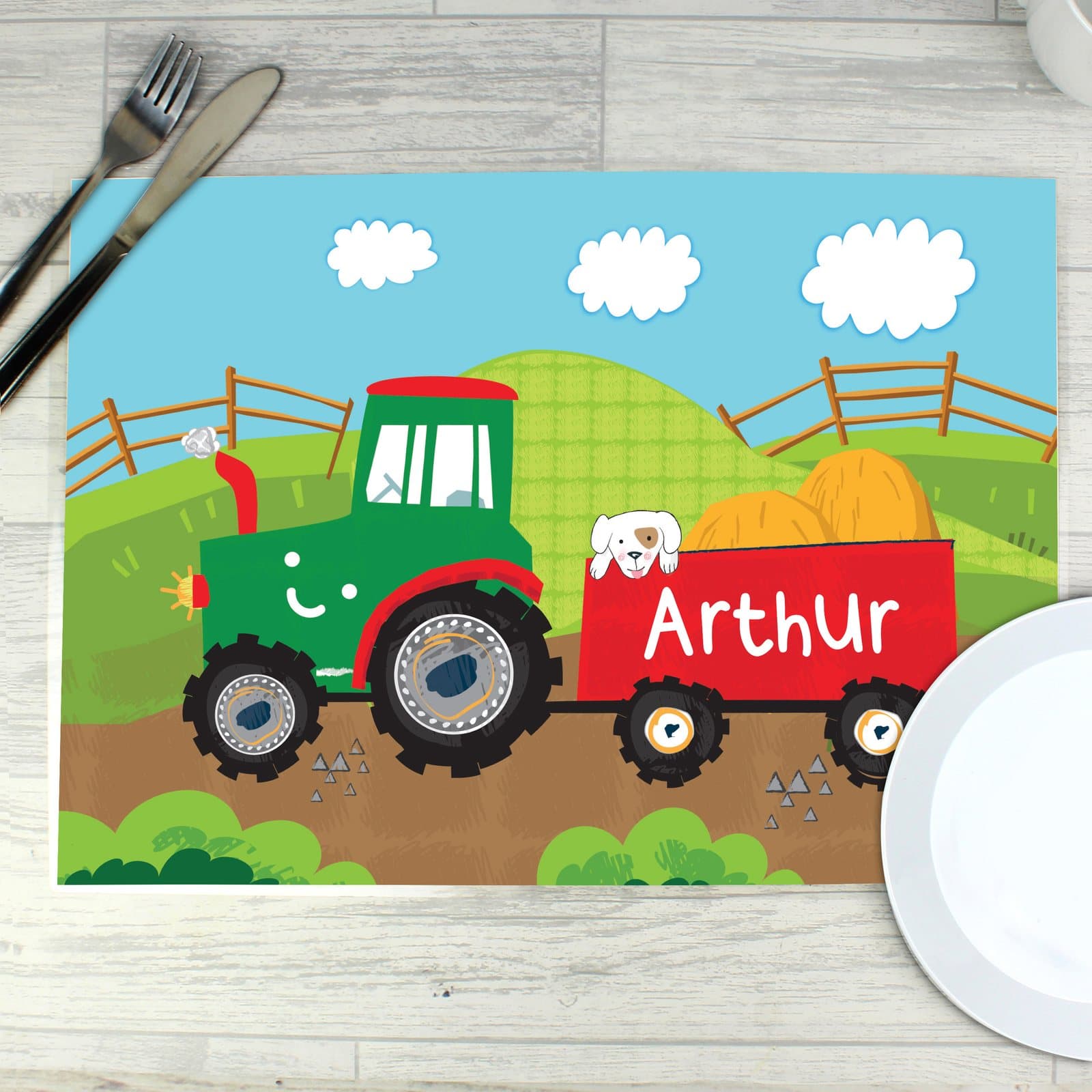 Laminated tractor placemat with a child's name printed on it