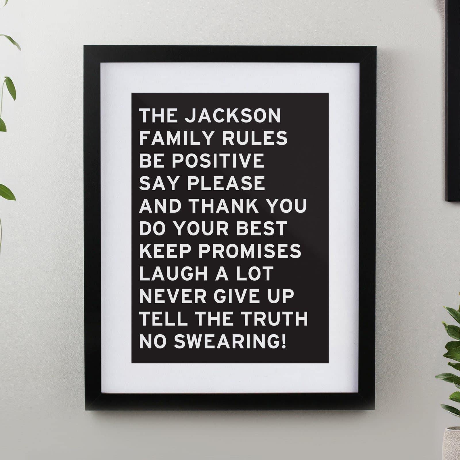 Black or white framed typography print with personalised lines of capital letters