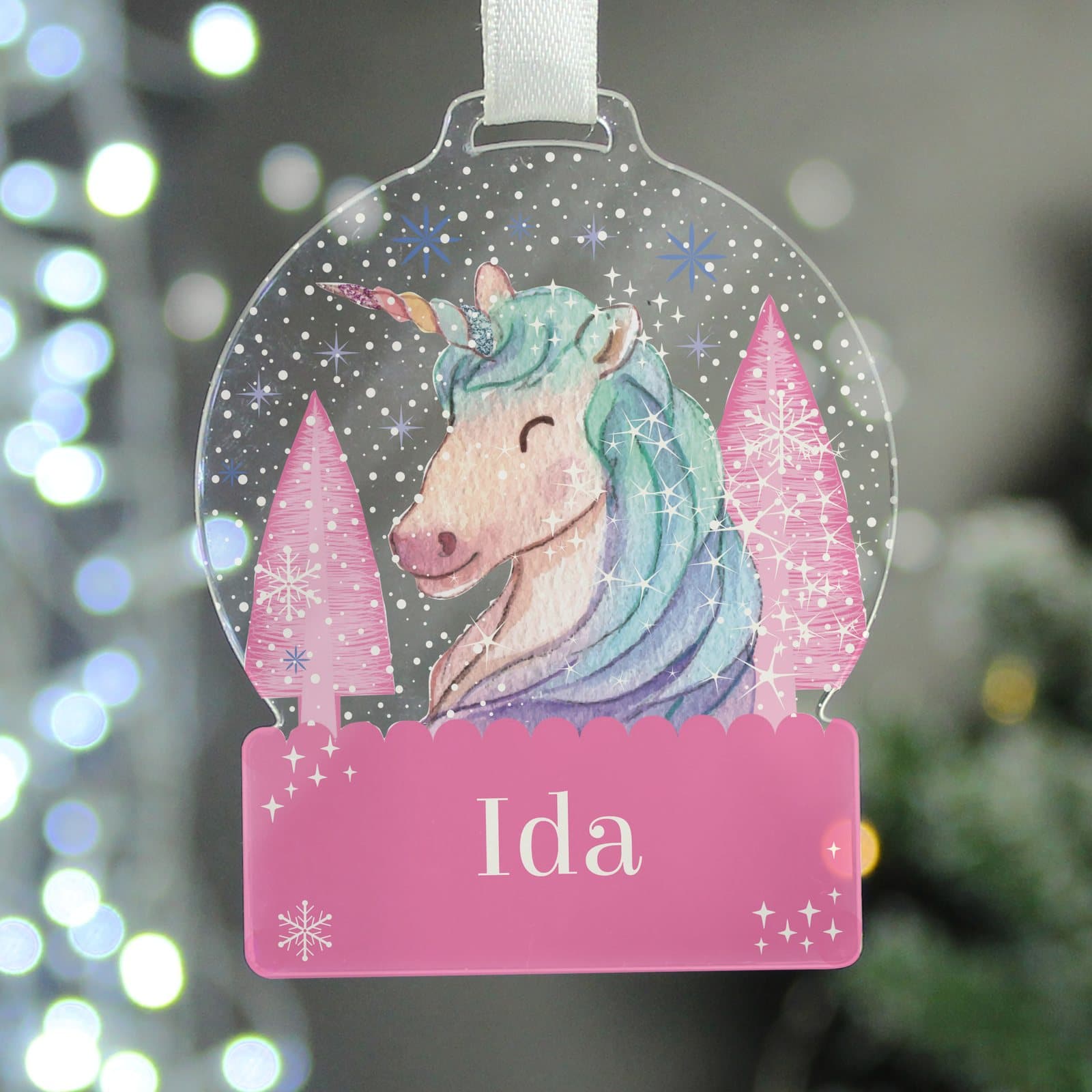 Acrylic snow globe shaped unicorn Christmas decoration with a name and white ribbon