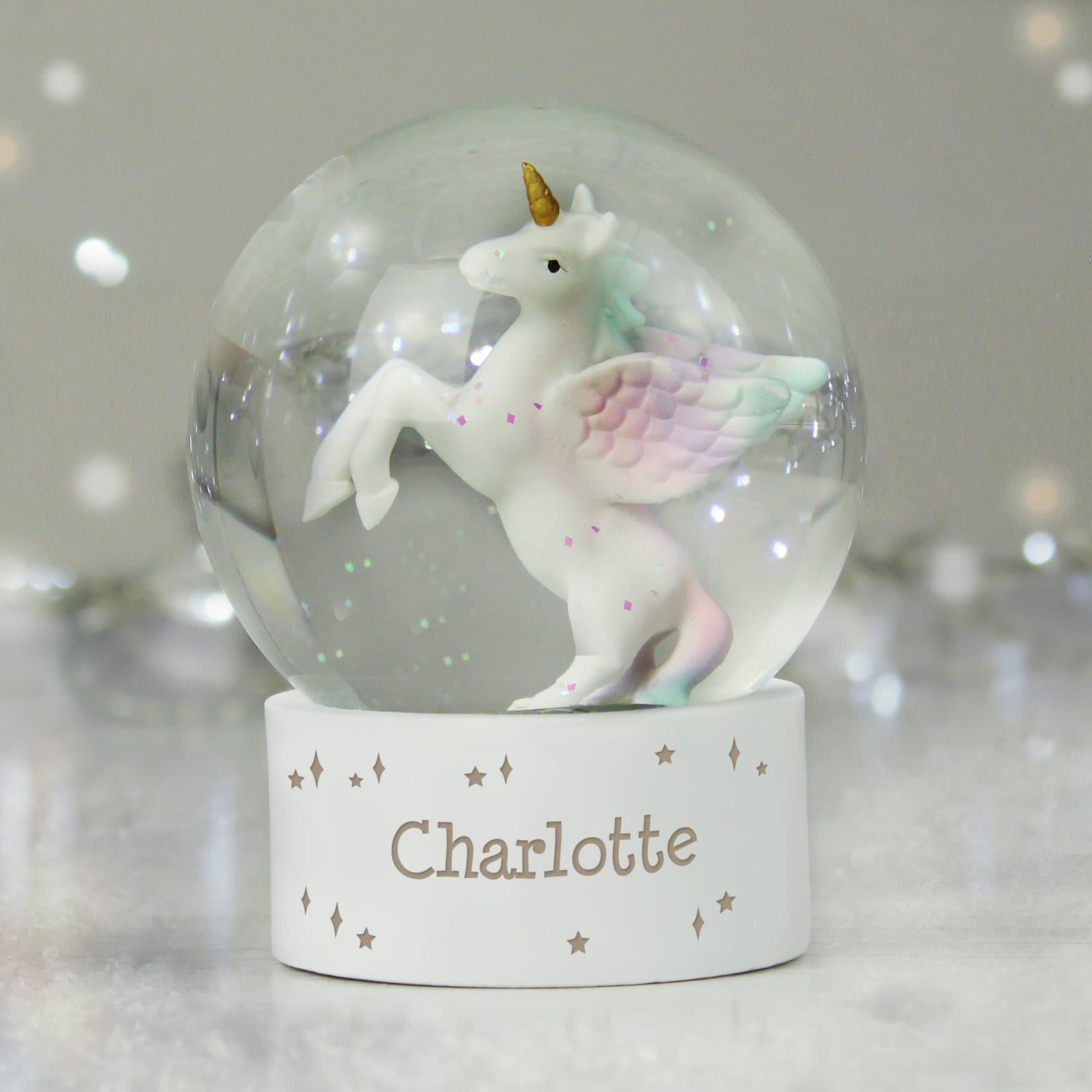 Glass unicorn snow globe filled with glitter and a name