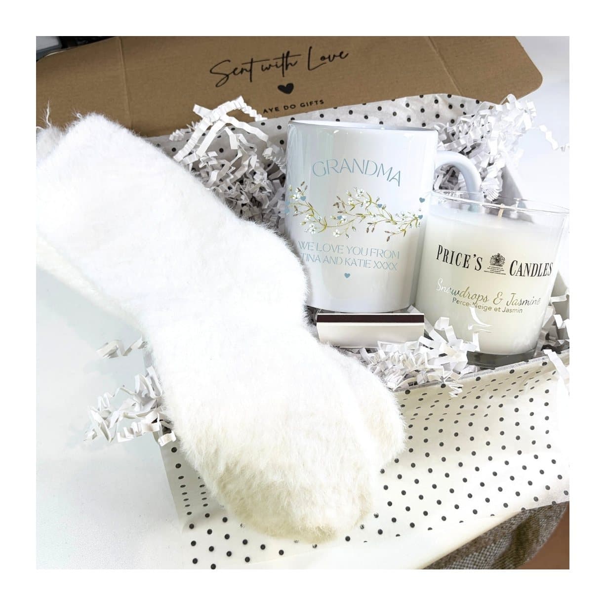 Personalised ceramic mug with fluffy socks, a scented candle and a box of matches