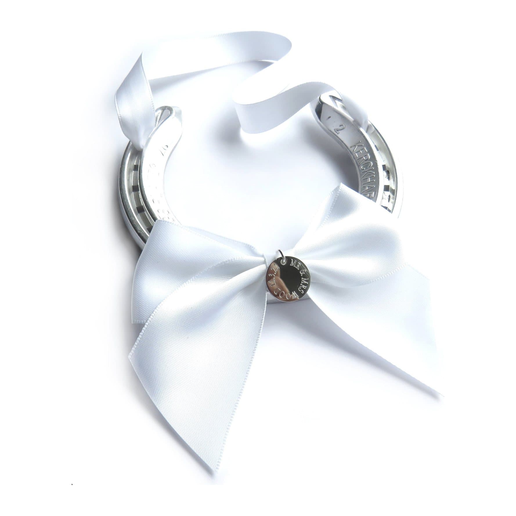 Silver coloured horseshoe with a white satin ribbon and a round engraved disc