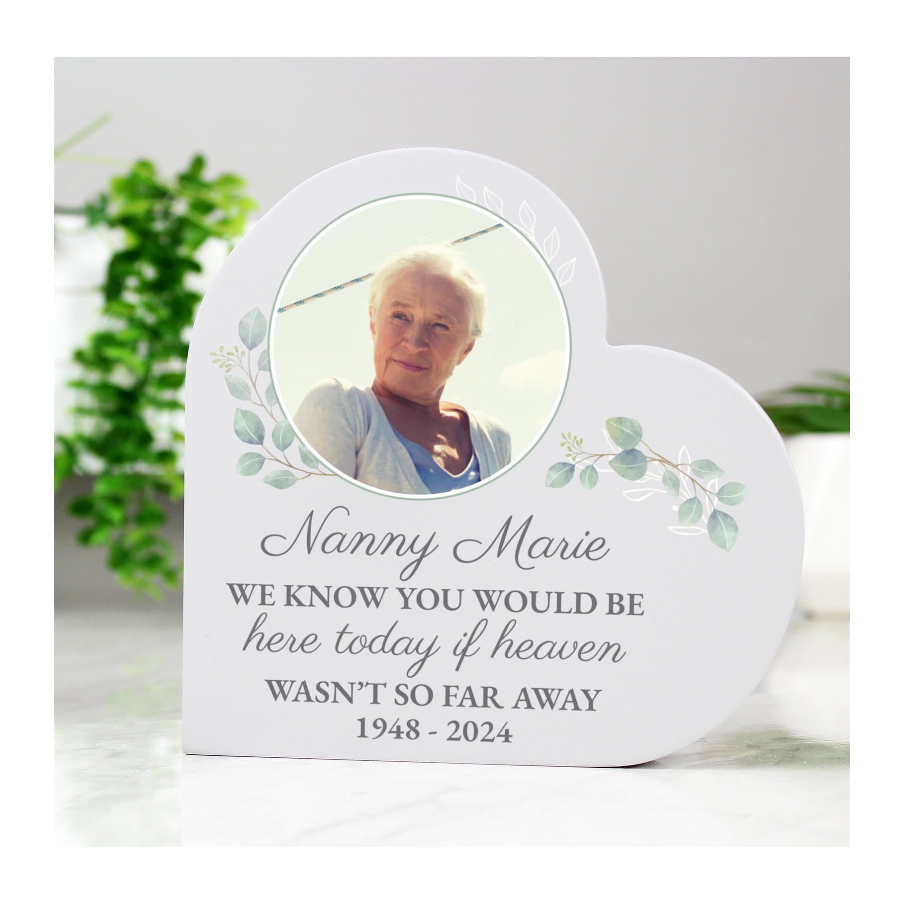 Grey painted wooden heart ornament with a photo and lines of text