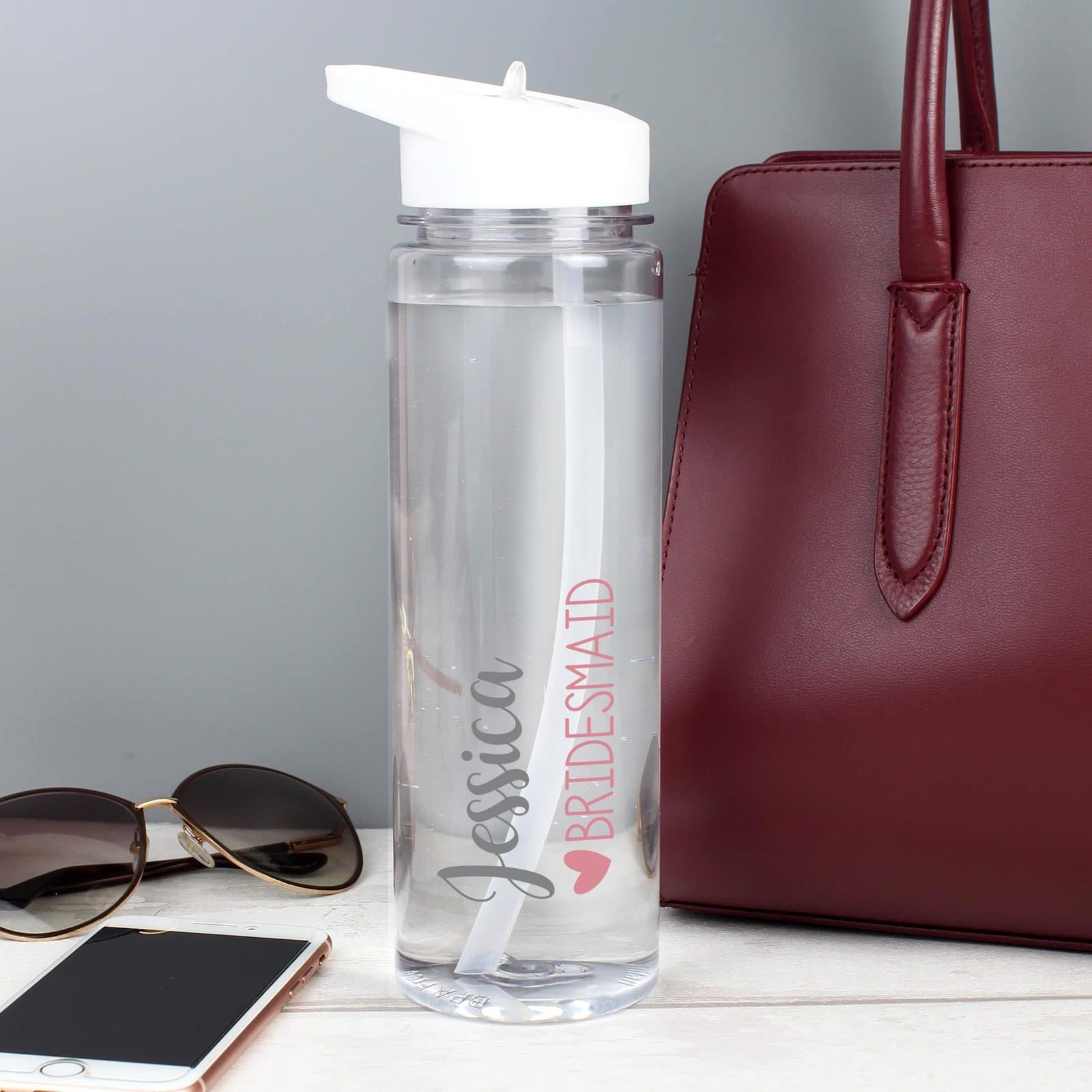 Personalised wedding party water bottle with white lid, flip-top spout and straw