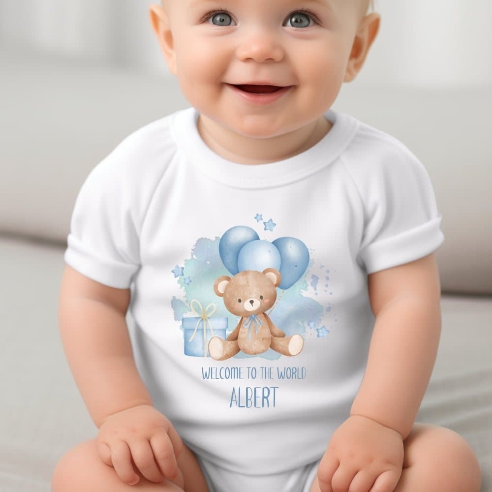 Blue Welcome to the World teddy with blue balloons on a personalised baby outfit