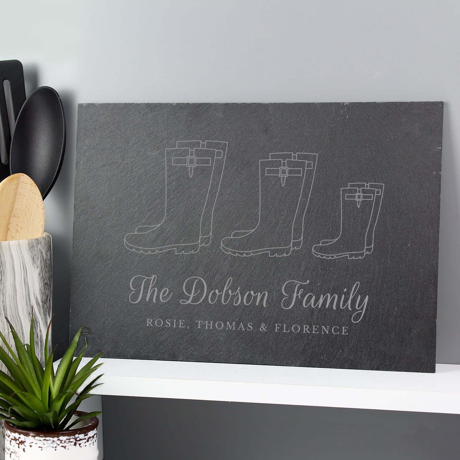 Slate placemat with a welly boot family of three design and personalised lines