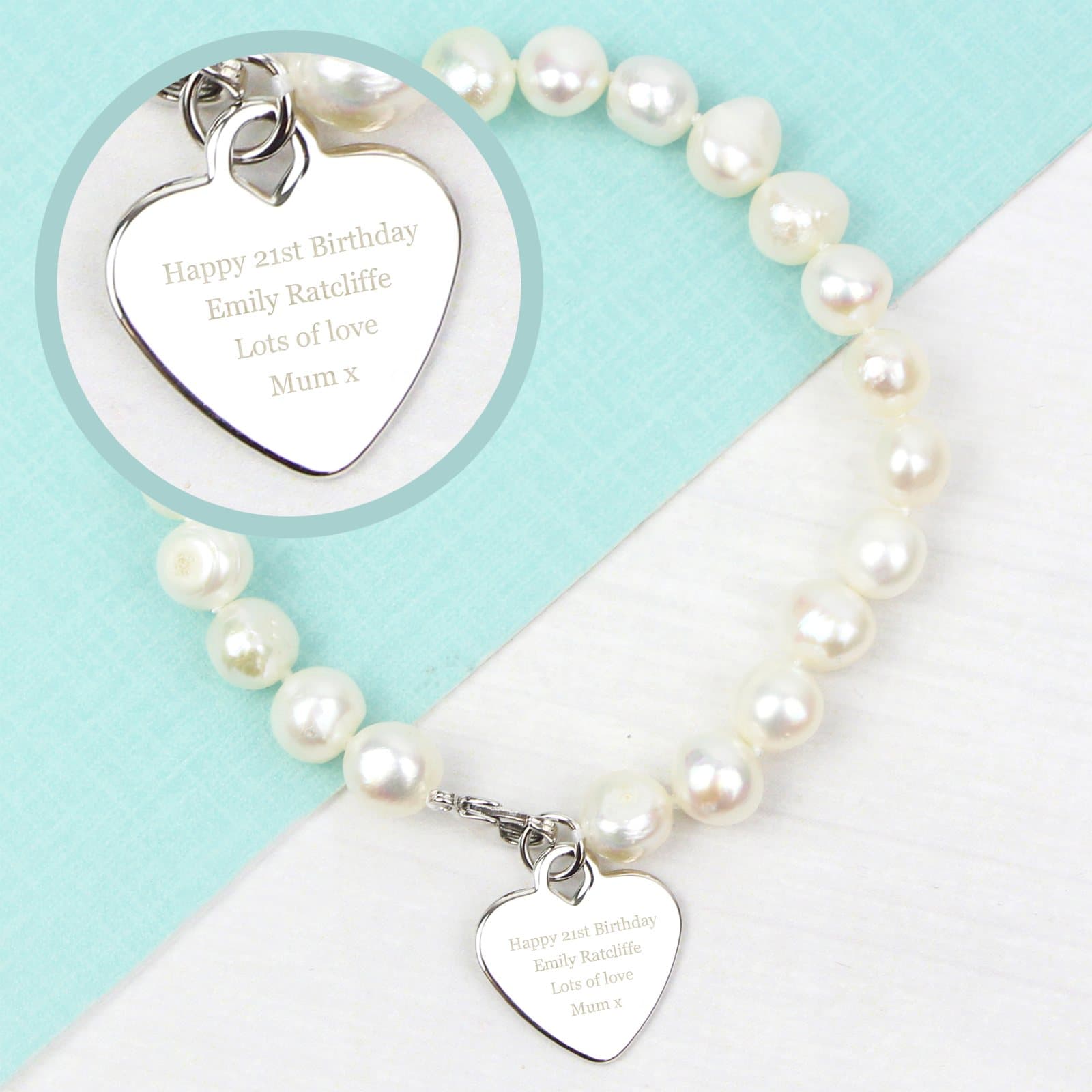 White freshwater pearl bracelet with a rhodium plated heart tag