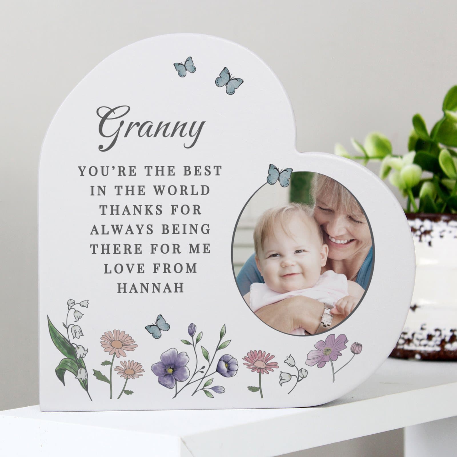Grey wooden heart ornament with a wildflower design, a photo and personalised text