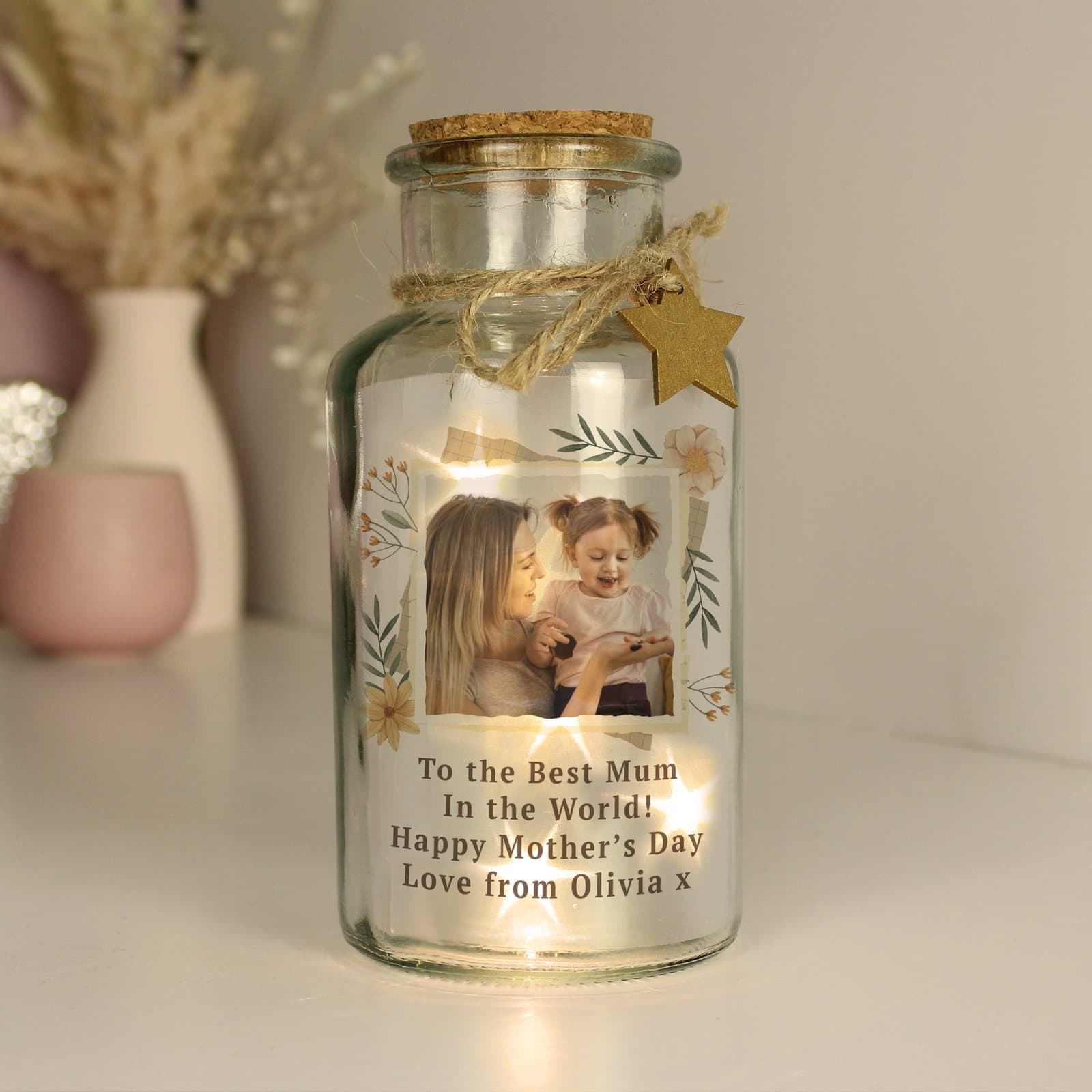 Glass LED jar with a wildflower illustration, a photo and four lines of text