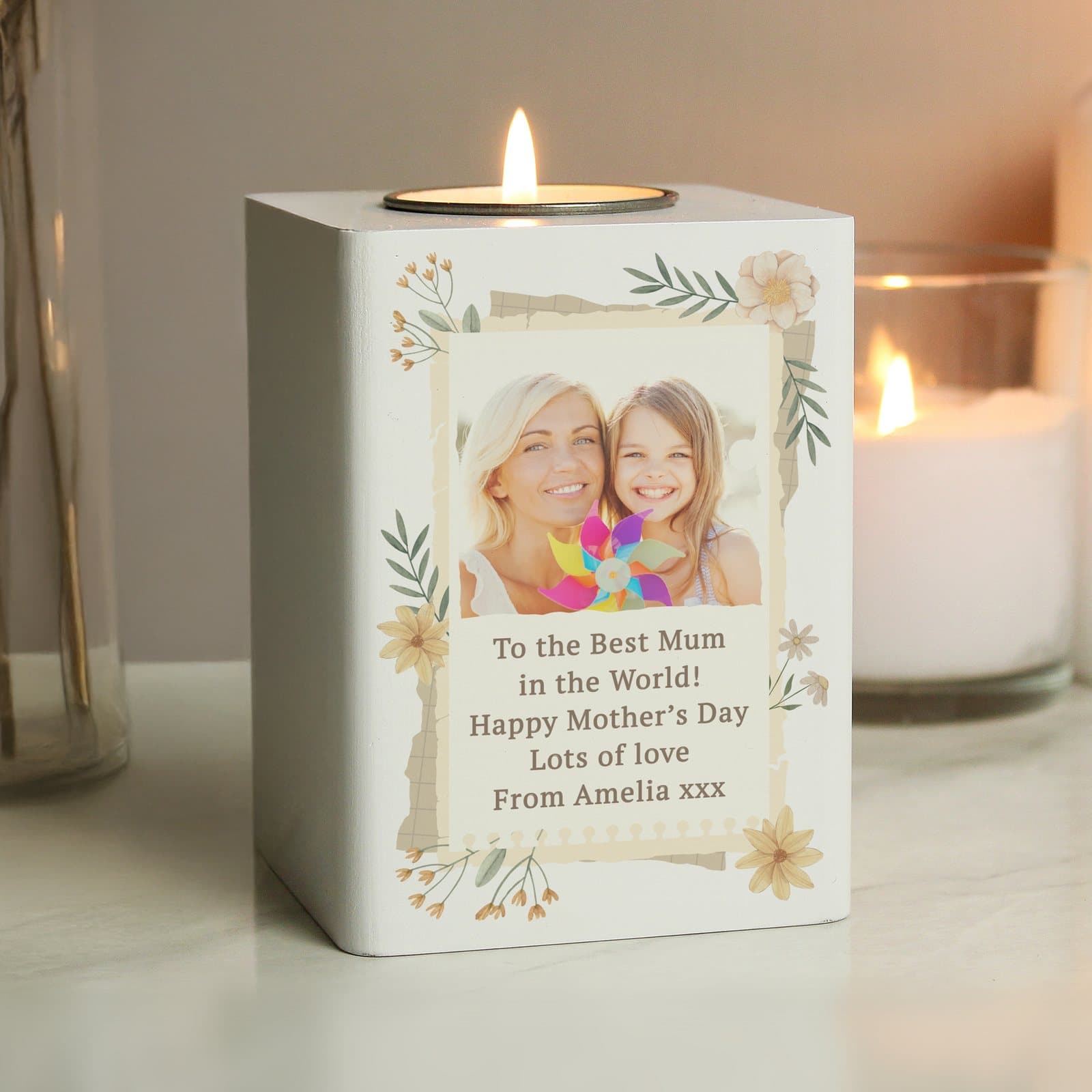 White painted wood tealight holder with an engraved wildflower design and photo