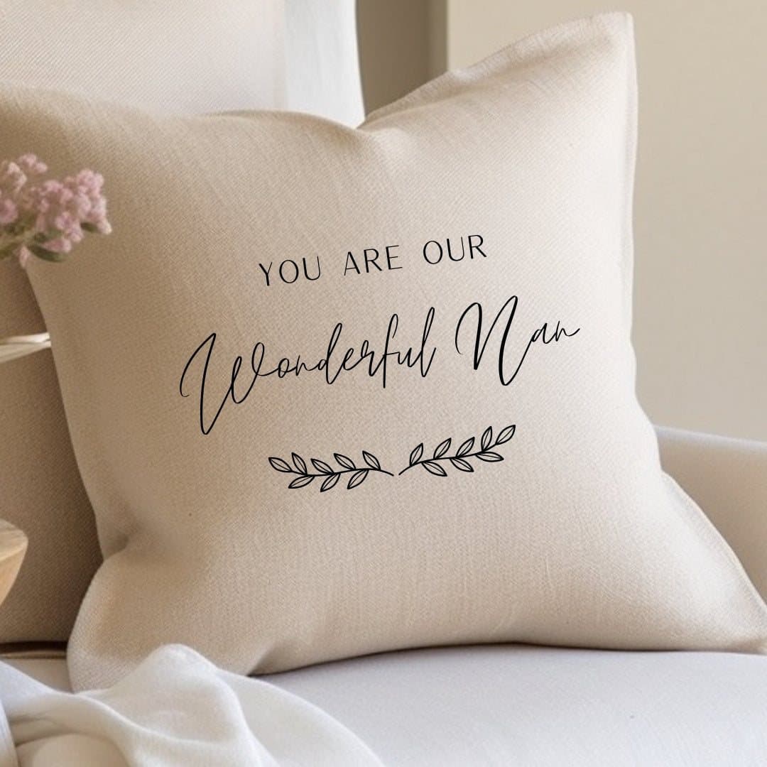 Cream linen effect square cushion with a leaf effect design