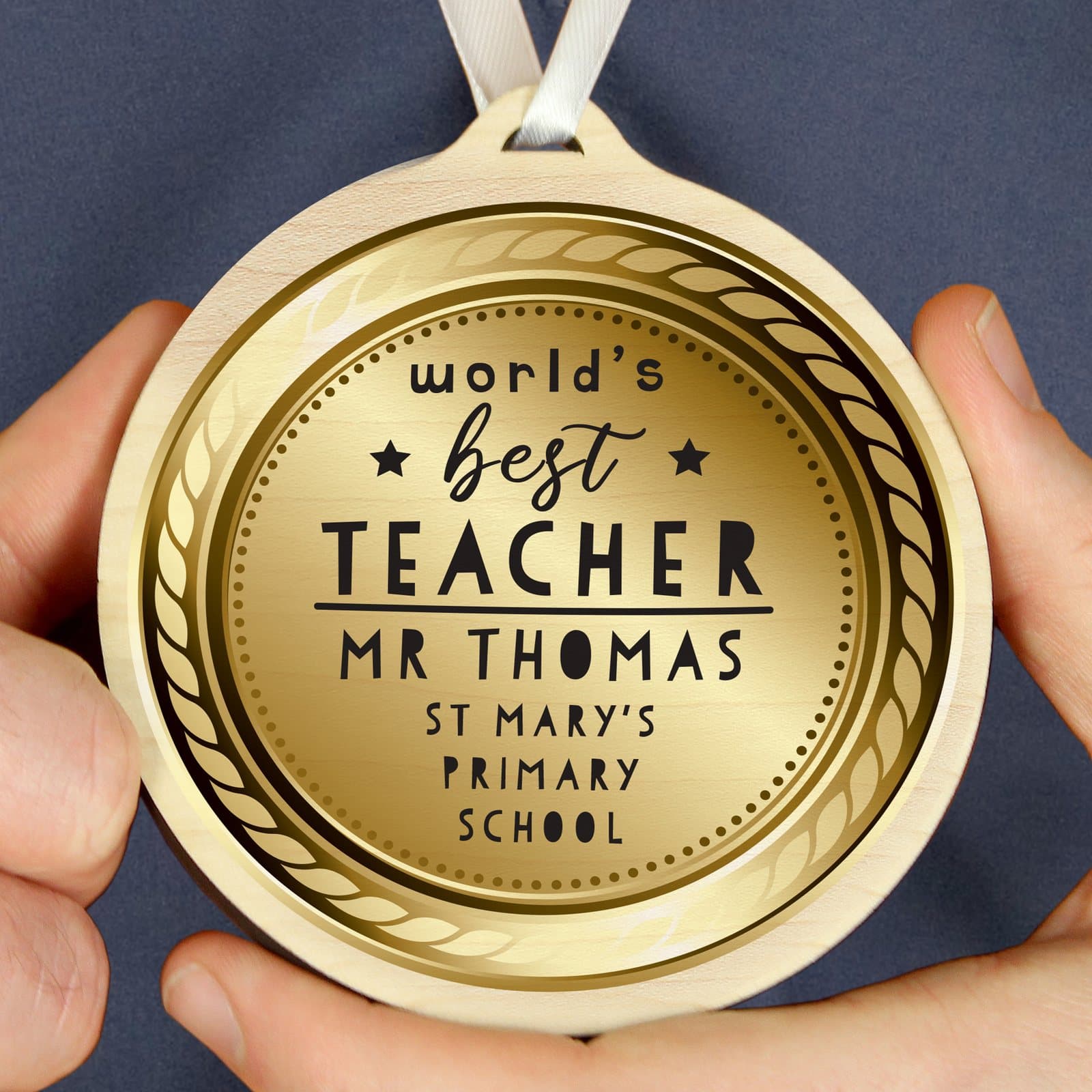 Round wooden World's Best Teacher medal with ribbon and personalised text