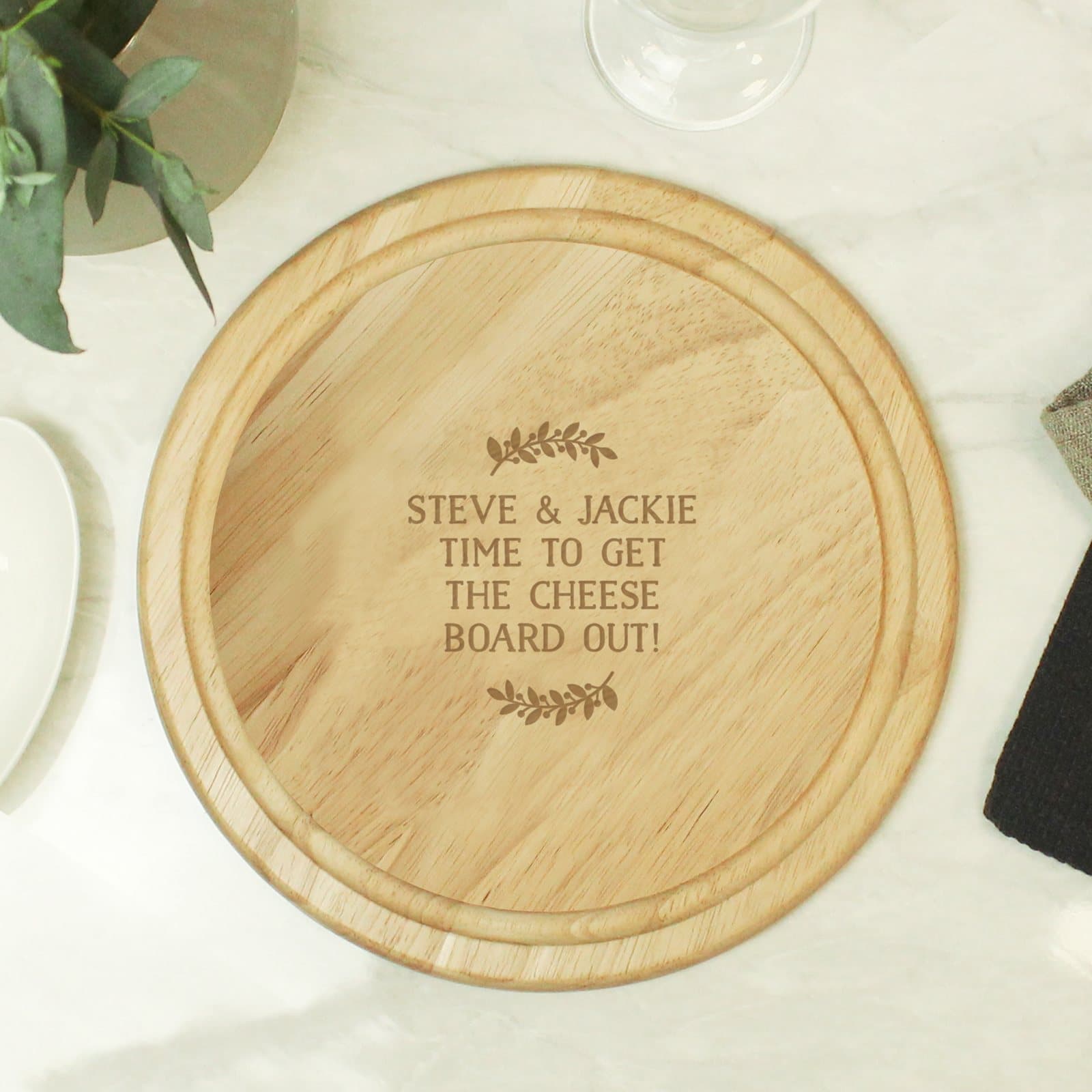 Wooden Christmas wreath chopping board with four lines of engraved text