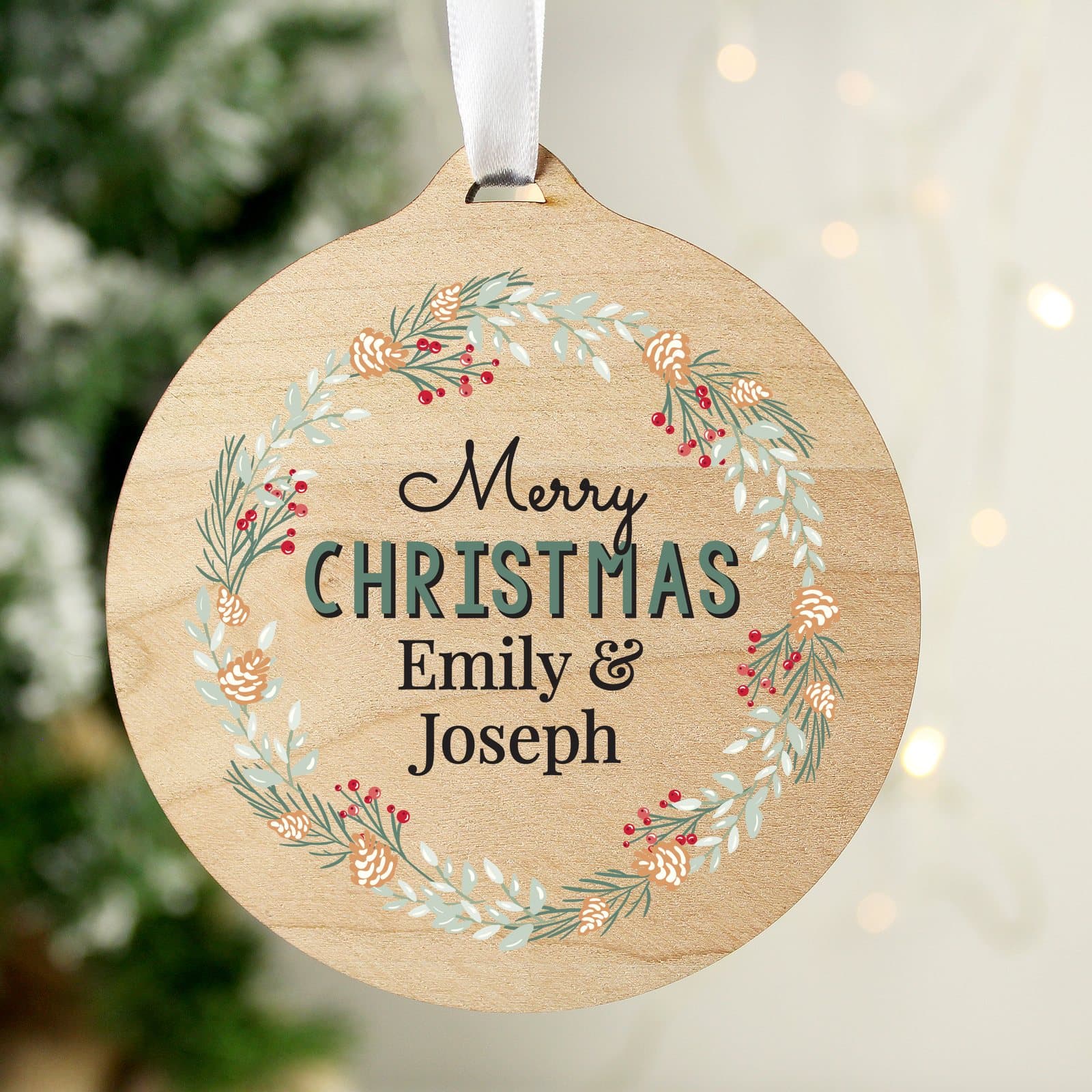Round wooden wreath Christmas decoration with four lines of text and ribbon