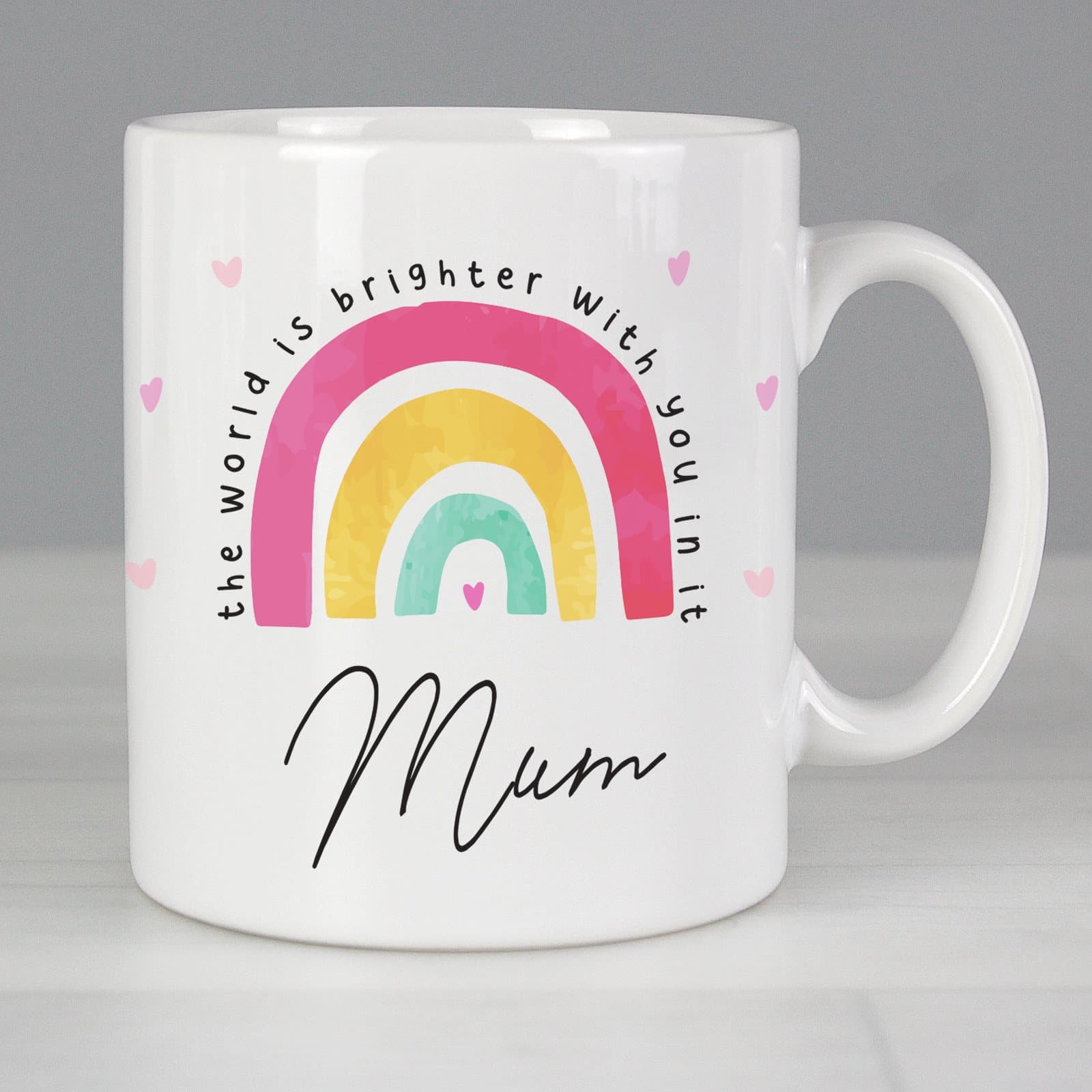 Ceramic rainbow mug with You Make The World Brighter wording and a personalised name