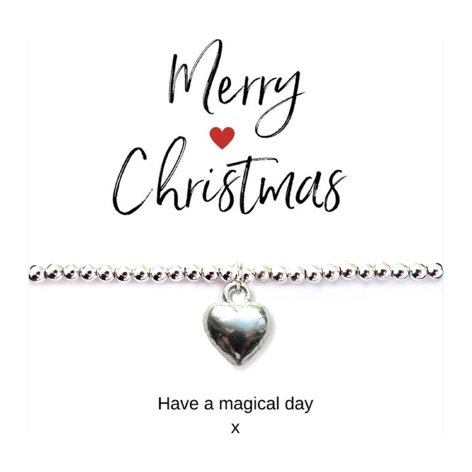 Silver puff heart charm bracelet on a Merry Christmas card