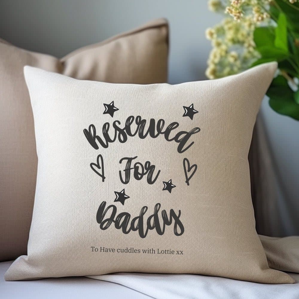 Cream linen-look cushion reading Reserved for Daddy, with stars and hearts