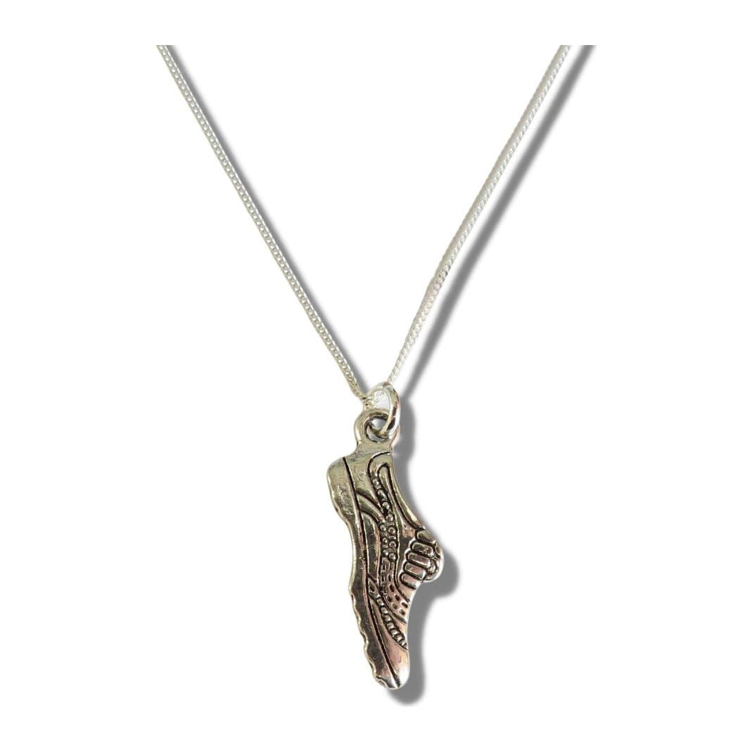 Silver necklace with a running shoe charm on a chain