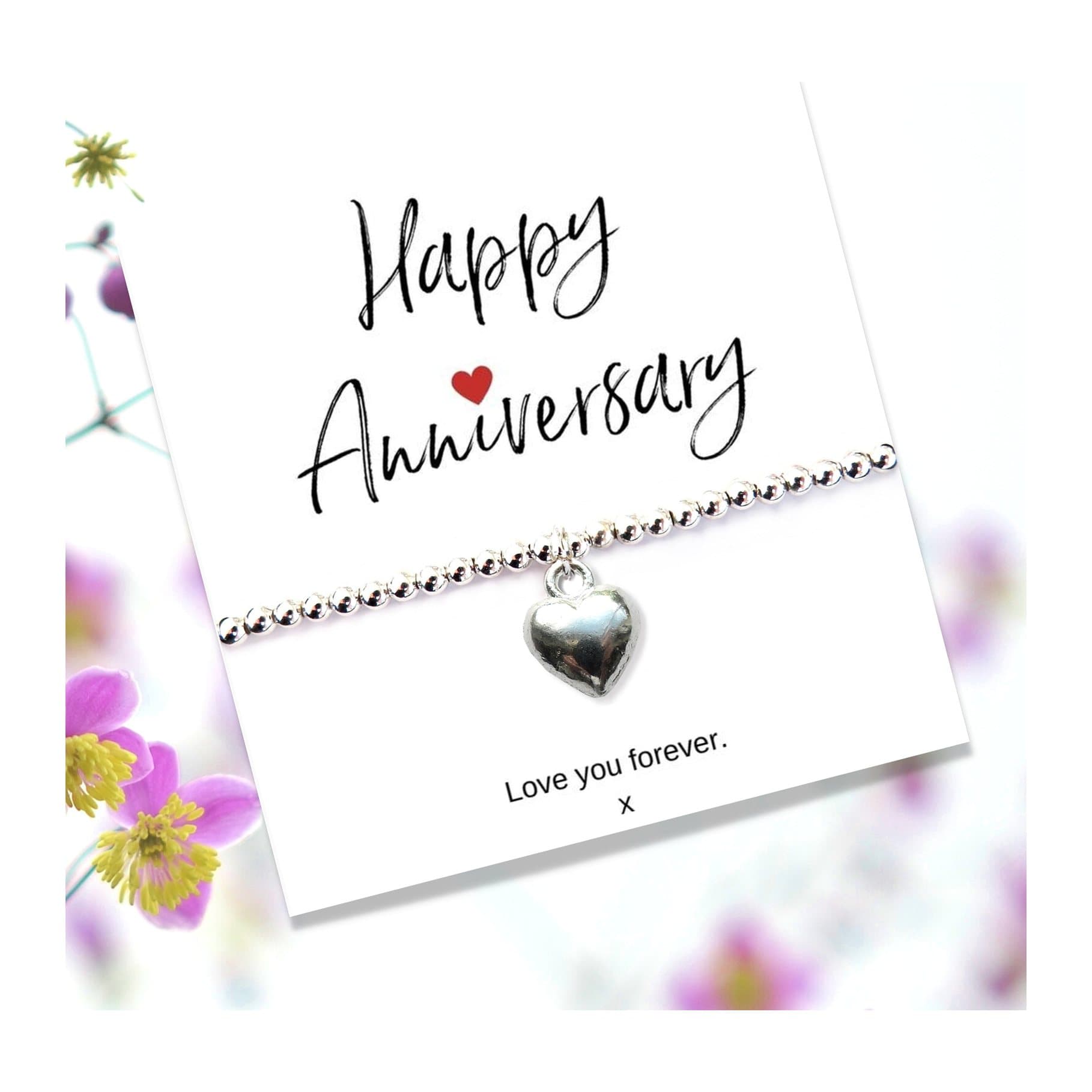 Silver heart beaded bracelet on an anniversary message gift card