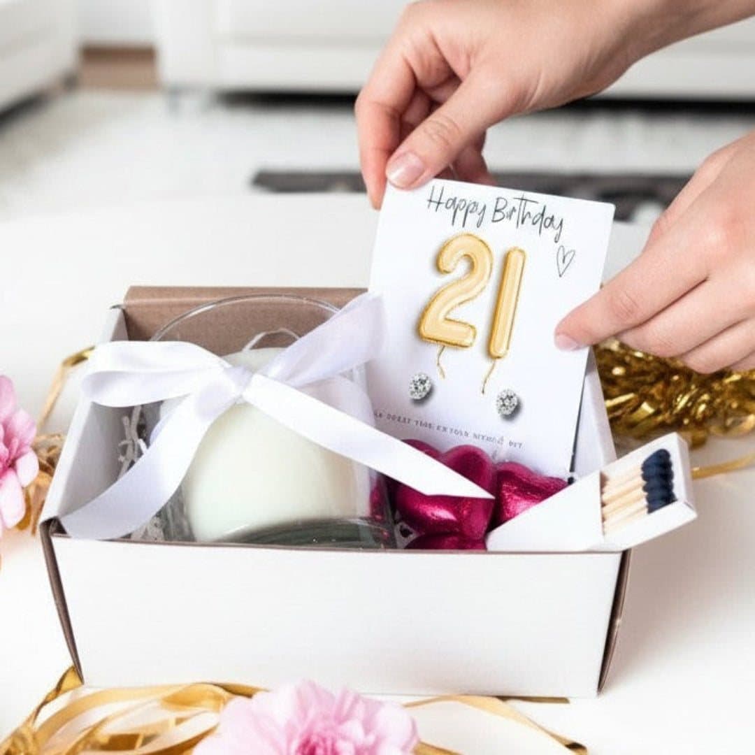 Small 21st birthday hamper with a vanilla candle, stud earrings and milk chocolate hearts