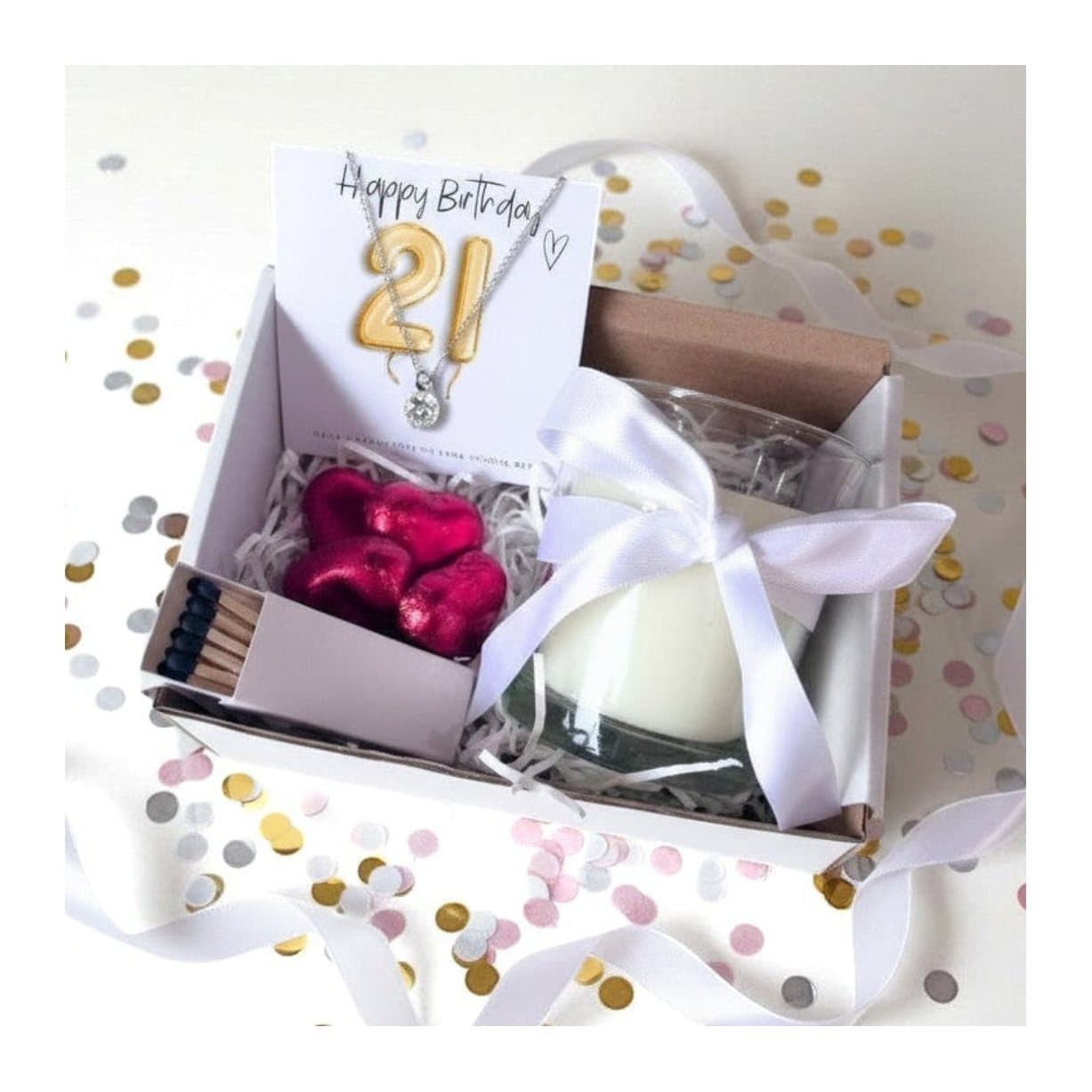 21st birthday gift hamper with a silver necklace, vanilla candle and chocolate hearts